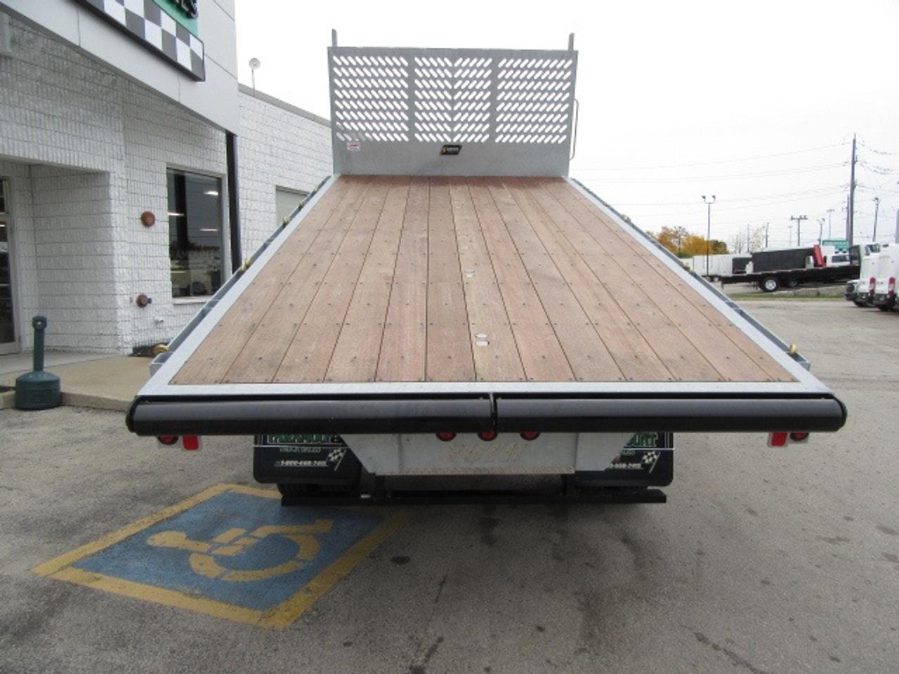 2024 RAM 5500 DIESEL 4X4 REG CAB 16 FT LUMBER DUMPING FLAT DECK Photo