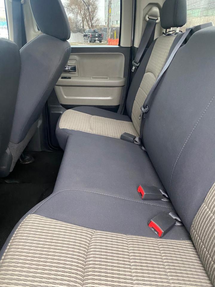 2010 Dodge Ram 1500 4WD Quad CAB 140.5 SLT Photo