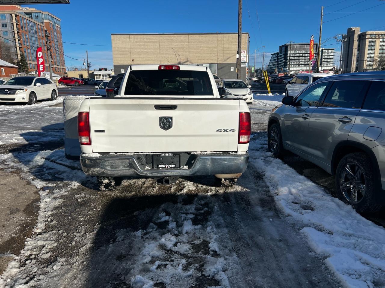 2010 Dodge Ram 1500 4WD Quad CAB 140.5 SLT Photo