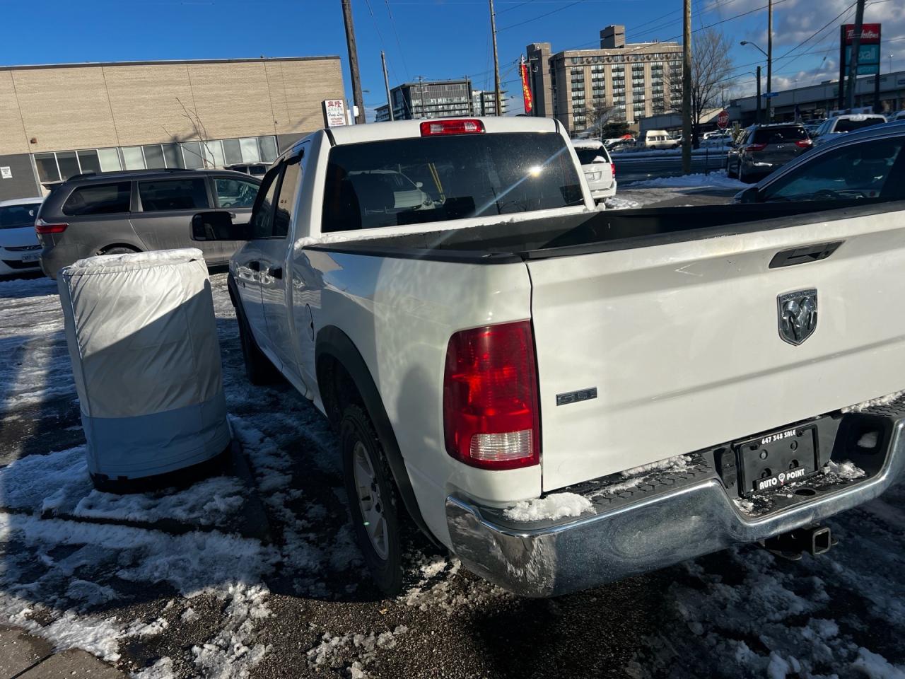 2010 Dodge Ram 1500 4WD Quad CAB 140.5 SLT Photo