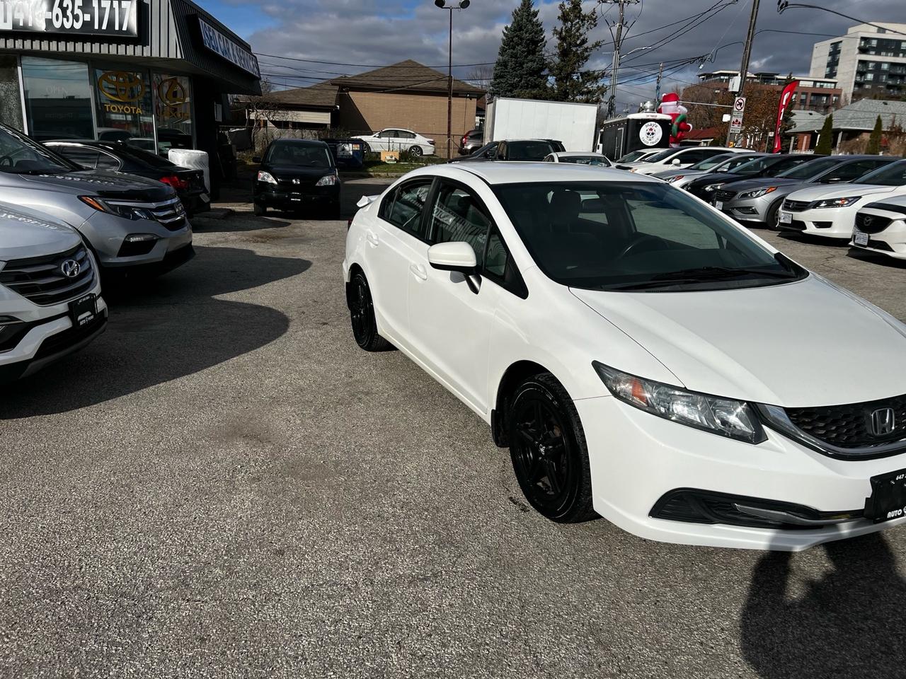 2015 Honda Civic 4dr Auto LX Photo3