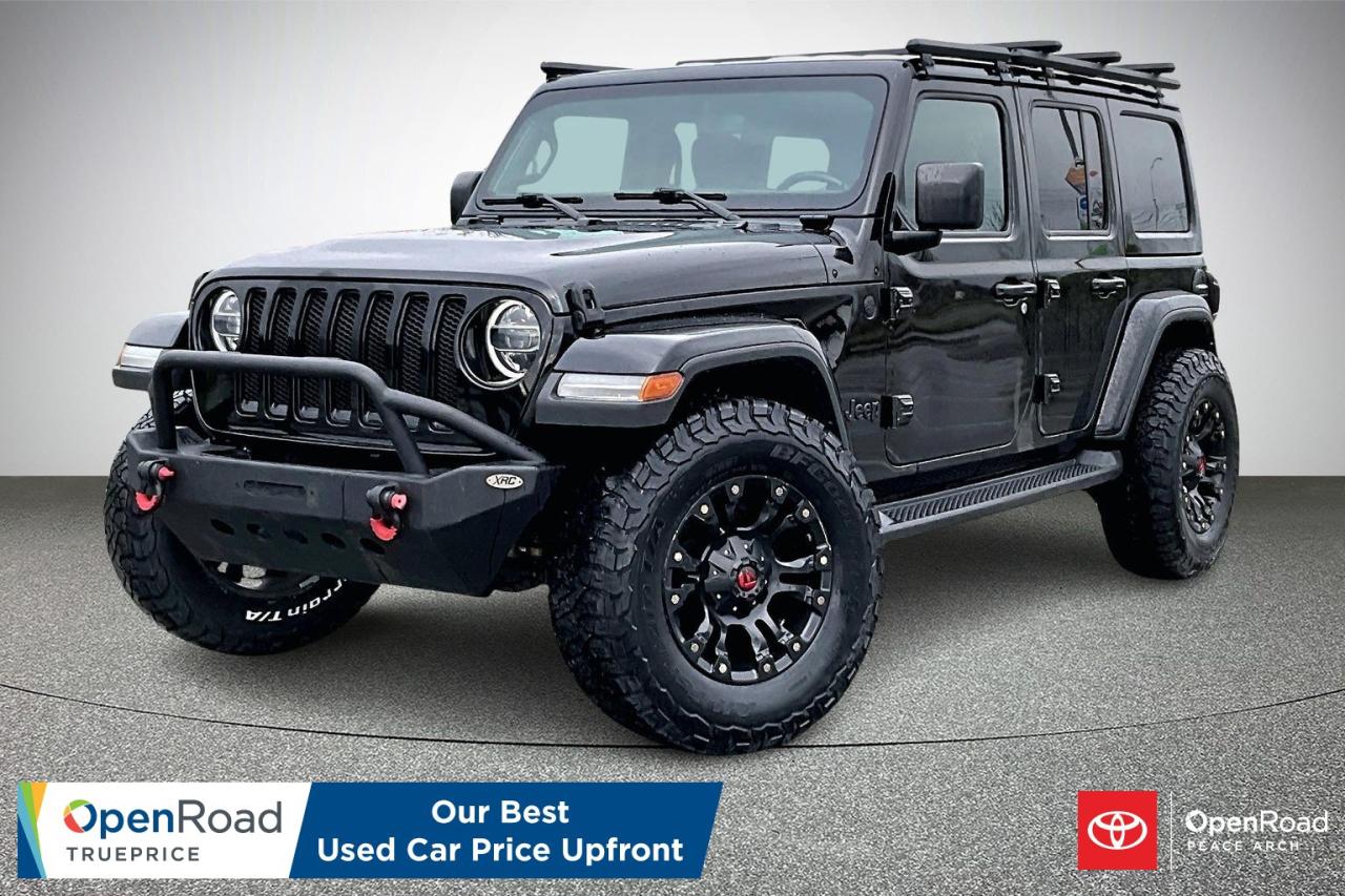 The 2021 Jeep Wrangler Unlimited Sahara with a manual transmission pairs a 3.6 L V6 engine with part-time four-wheel drive for authentic off-road performance. It features 18-inch aluminum wheels, body-colour fender flares, and the modular Freedom Top for open-air versatility. The interior provides supportive seating, a 7-inch touchscreen with Apple CarPlay and Android Auto, and convenient heated side mirrors. A manual transfer case enhances driver engagement, while modern safety features such as a rearview camera, stability control, and tire-pressure monitoring support confident everyday driving. This model blends classic Jeep capability with comfort-focused amenities.  Have confidence with your OpenRoad purchase! Every OpenRoad Certified Pre-Owned vehicle comes fully reconditioned and complete with a comprehensive 153 point mechanical inspection, a CarFax history & lien report, a 3-Day Money Back Guarantee, a 30-Day/2,000 kms Exchange Policy, a 90-Day/5,000 kms Powertrain Warranty, guaranteed clear title, and membership to our exclusive Club OpenRoad! As a proud member of the OpenRoad Auto Group, a trusted name since 2000 serving the Lower mainland (including White Rock, Surrey, Langley, Maple Ridge, Delta, Richmond, Mission and beyond) with outstanding Toyota vehicles, Toyota parts, and Toyota service since 1966! OpenRoad Toyota Peace Arch is a &ldquo;True Price&rdquo; dealer, meaning no inflated prices, and no need for back and forth haggling! We use up to the minute technology offering LIVE MARKET VALUE PRICING to ensure you are receiving the most competitive price possible on all of our Pre-Owned vehicles!  All advertised vehicle prices do not include our $599 documentation fee.