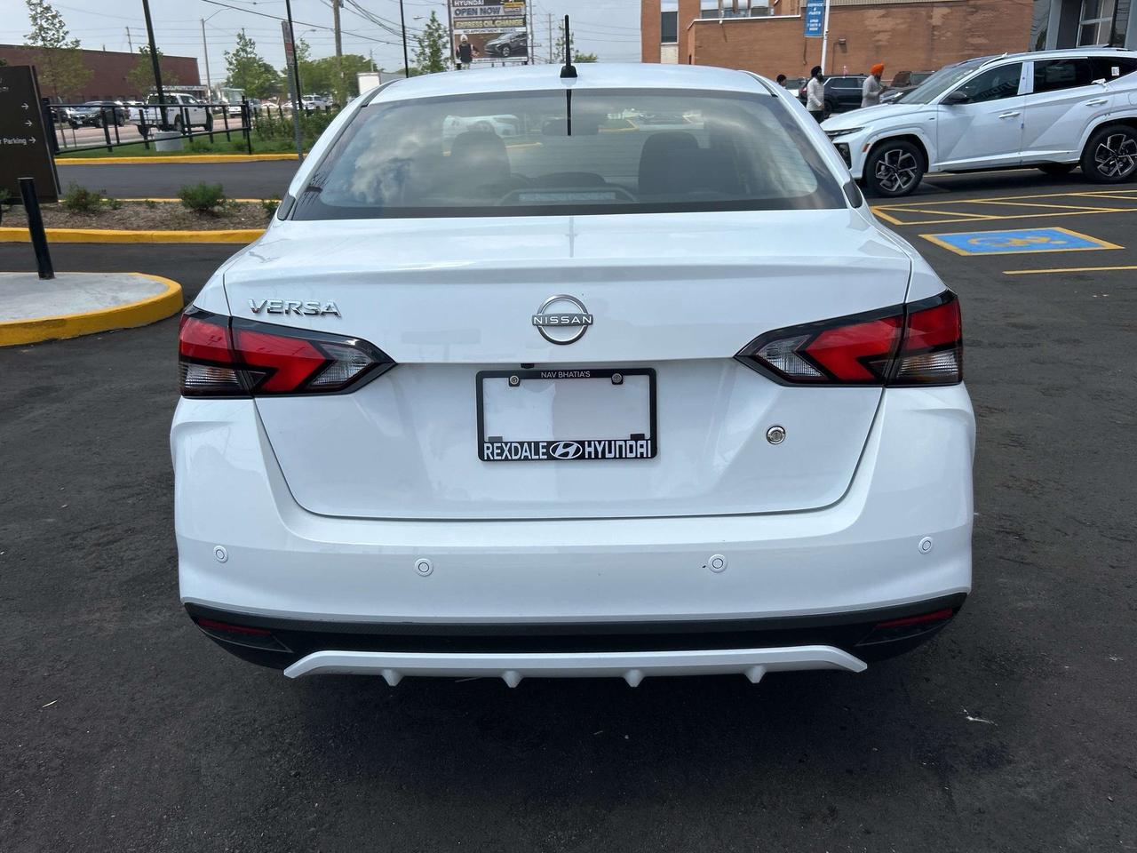 2024 Nissan Versa S FWD CVT   CLEAN CAR FAX Photo3