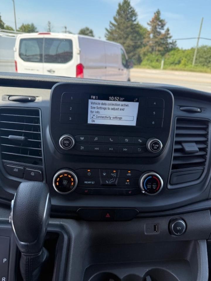 2020 Ford Transit Cargo Van Divider, Shelving, Power seat. Photo