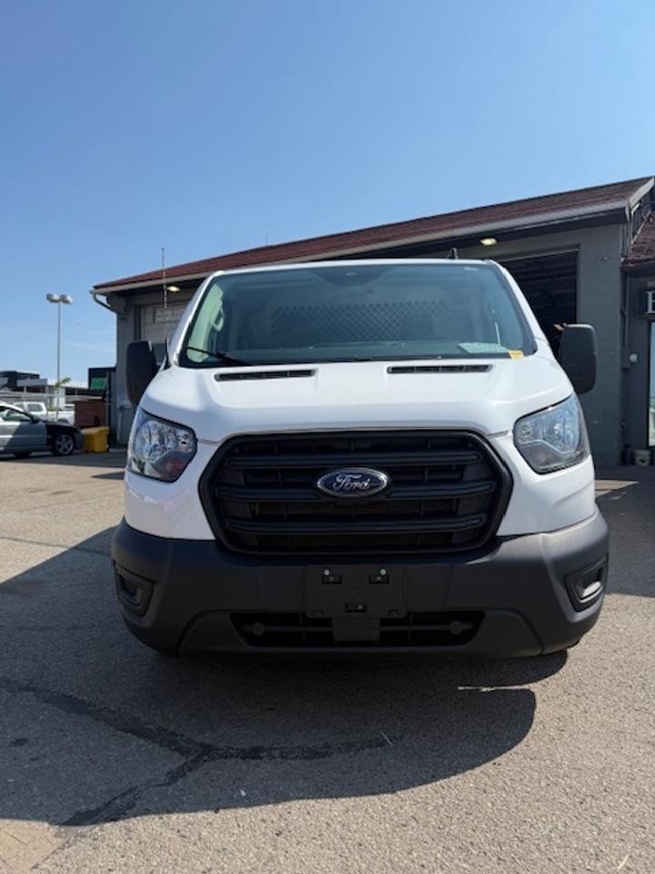 2020 Ford Transit Cargo Van Divider, Shelving, Power seat. Photo