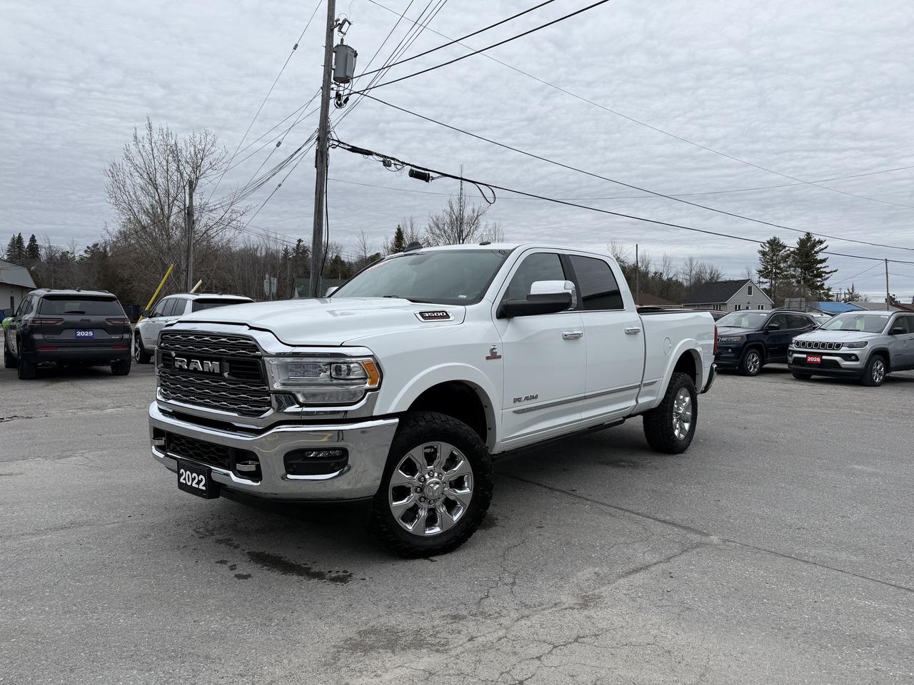 2022 RAM 3500 LIMITED CREW CAB 4X4.  6.7L HIGH OUTPUT CUMMINS DIESEL ENGINE WITH HEAVY DUTY AISIN TRANSMISSION.  12" SCREEN WITH NAVIGATION, NATURA LEATHER HEATED & COOLED SEATS,  POWER DROPPING SIDE STEPS, ALPINE SOUND SYSTEM, POWER DRIVER & PASSENGER SEATS WITH DRIVER MEMORY SETTINGS, WIRELESS CHARGING PAD, DUAL ZONE CLIMATE CONTROL, 2ND ROW HEATED SEATS, REMOTE START, HEATED STEERING WHEEL, CLASS V HITCH, BLIND SPOT MONITOR WITH REAR CROSS PATH DETECTION, FRONT & REAR PARK ASSIST, RAIN SENSING WINDSHIELD WIPERS, POWER ADJUSTABLE PEDALS, REMOTE RELEASE TAILGATE, & MORE!  ONLY HST EXTRA.