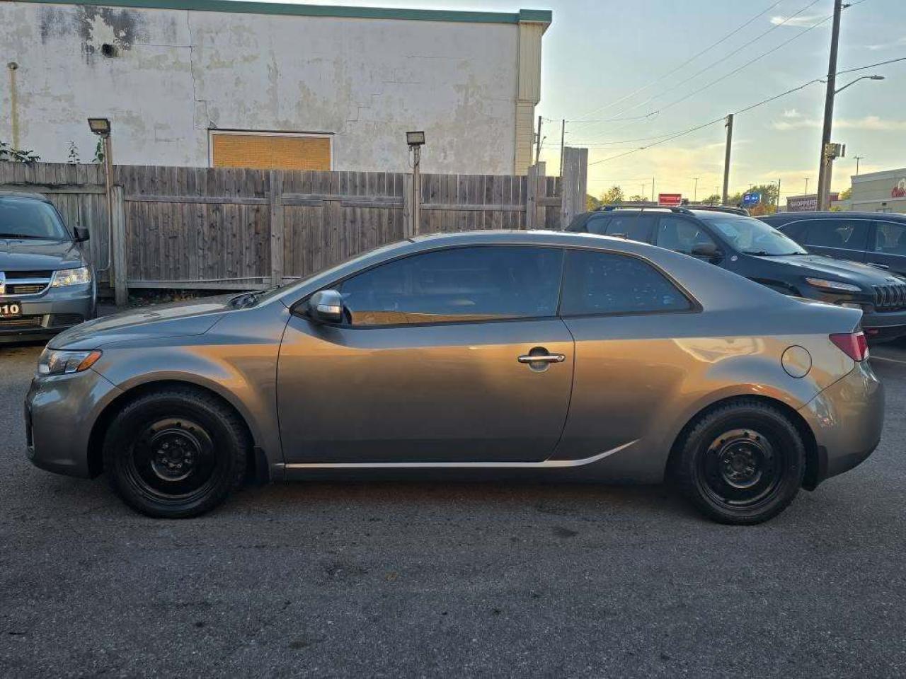 2010 Kia Forte Koup 2dr Cpe Auto SX Photo