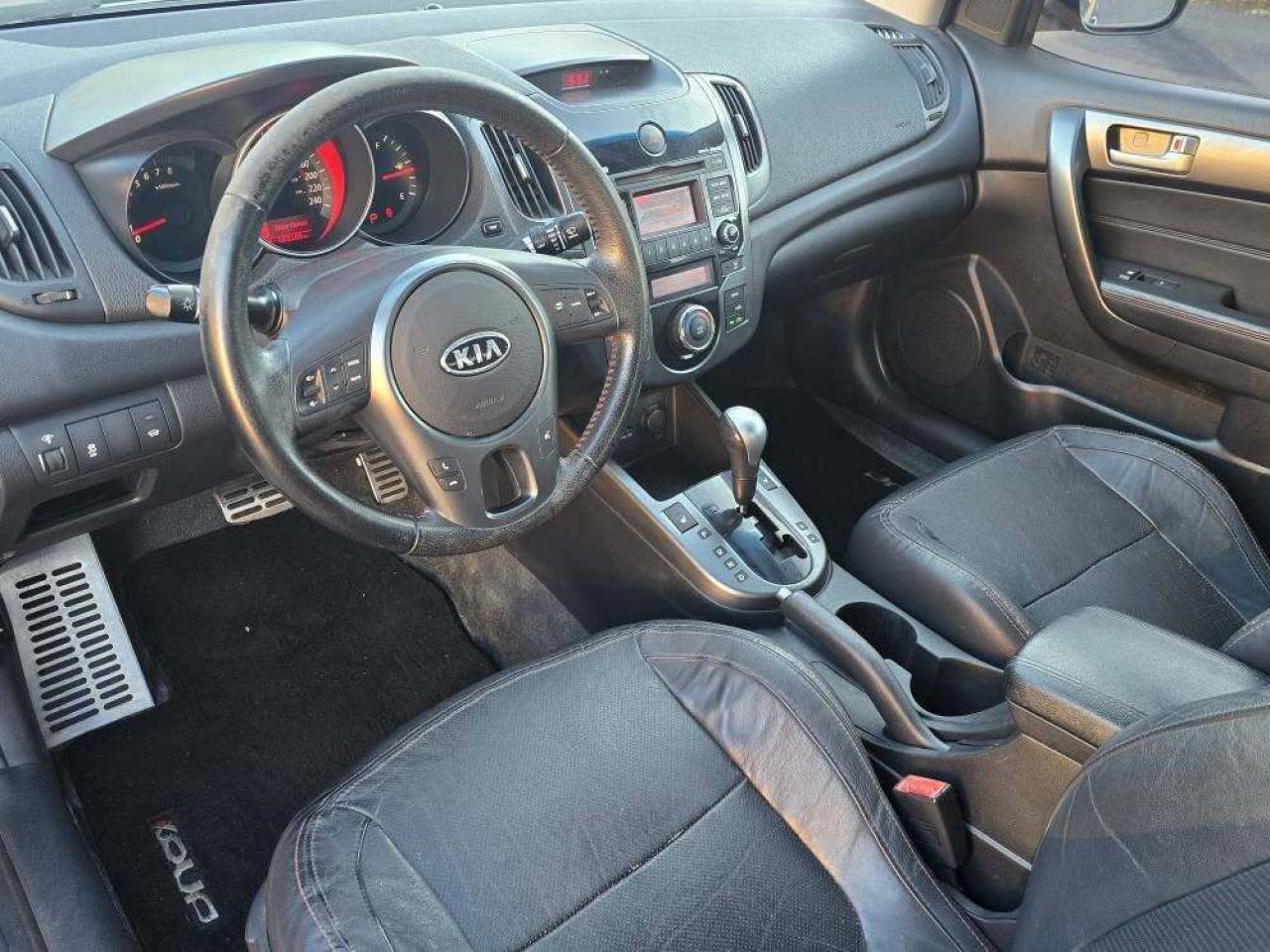 2010 Kia Forte Koup 2dr Cpe Auto SX Photo