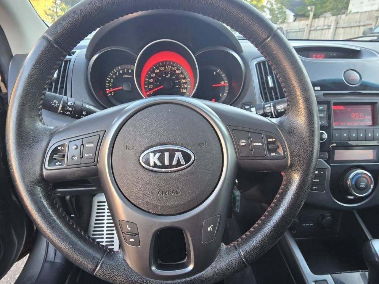 2010 Kia Forte Koup 2dr Cpe Auto SX Photo