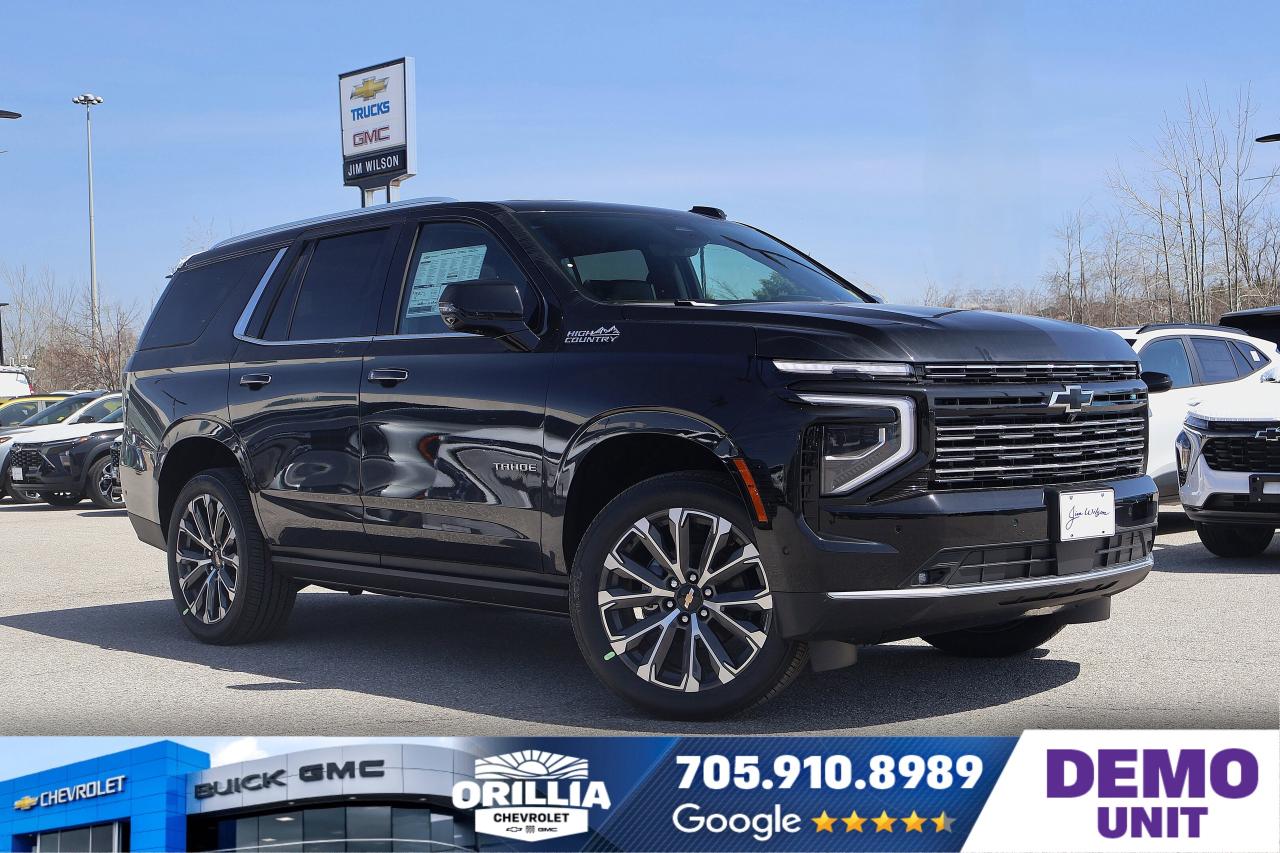 Lane Departure Warning | Heated Steering Wheel | Leather-like Interior | Keyless Entry | 8-Speed Automatic Transmission

The 2025 Chevrolet Tahoe High Country is a full-size luxury SUV designed to deliver power, capability, and refined comfort. At its core, it features a robust 6.2-litre Gas V8 engine, paired with an automatic transmission and an all-wheel-drive system, built to maintain strong performance and traction across diverse Canadian road conditions. This engine configuration offers impressive horsepower and torque, suitable for towing, hauling, and providing a confident driving experience both on highways and rough terrain.

The exterior of the Tahoe High Country in this model year is distinguished by its striking red paint, complemented by premium features such as fog lights for enhanced visibility, daytime running lights, and privacy glass that not only adds style but also improves passenger comfort. Functional elements include a luggage rack integrated into the roof design, power lift gates for easy cargo access, and a tow package engineered to help with heavy-duty towing tasks. The rear window is equipped with a defroster, and rain sensor wipers add convenience in wet weather by automatically adjusting wipe frequency.

Inside, the vehicle emphasizes luxury and driver assist technology. The leather interior provides a sophisticated look and feel, with bucket seats that offer individualized comfort for driver and front passenger. The drivers seat is power-adjustable to find the perfect driving position, and the steering wheel is heated and fitted with audio controls for ease of use without distraction. Climate control ensures optimal comfort with separate rear air and heating settings. Illumination inside the cabin includes an illuminated visor mirror, further emphasizing the vehicle&acirc;??s attention to detail.

Technology and safety are integrated comprehensively into the 2025 Tahoe High Country. Vehicle navigation guidance is provided via an advanced navigation system paired with a heads-up display that projects key driving information onto the windshield. Adaptive cruise control enhances highway driving by maintaining set distances from traffic ahead, while lane departure warnings provide alerts to help maintain safe lane discipline. Reverse park assist with parking sensors aids in maneuvering tight spaces, and stability and traction control systems help by automatically adjusting power delivery and braking to maximize road grip. Additional safety measures include multiple airbags, child safety locks, and a robust security system.

The Chevrolet Tahoe High Country also features conveniences such as keyless entry, power windows and locks, remote trunk release, and windshield wipers that operate intermittently with smart sensors for weather adaptation. The audio system offers premium satellite radio entertainment, enhancing the driving environment for all passengers.

Specifications:

- Engine: 6.2 litre Gas V8
- Drivetrain: All-wheel drive with automatic transmission
- Seating: Leather bucket seats with power drivers seat adjustment
- Safety: Adaptive cruise control, lane departure warning, reverse park assist, traction control, multiple airbags
- Technology: Navigation system, heads-up display, premium satellite radio, power lift gates, heated steering wheel 
Special Code: DEMO221