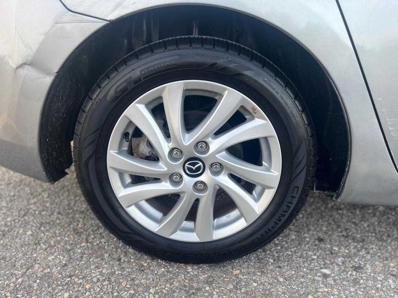 2012 Mazda MAZDA3 4dr Sdn Auto GX Photo