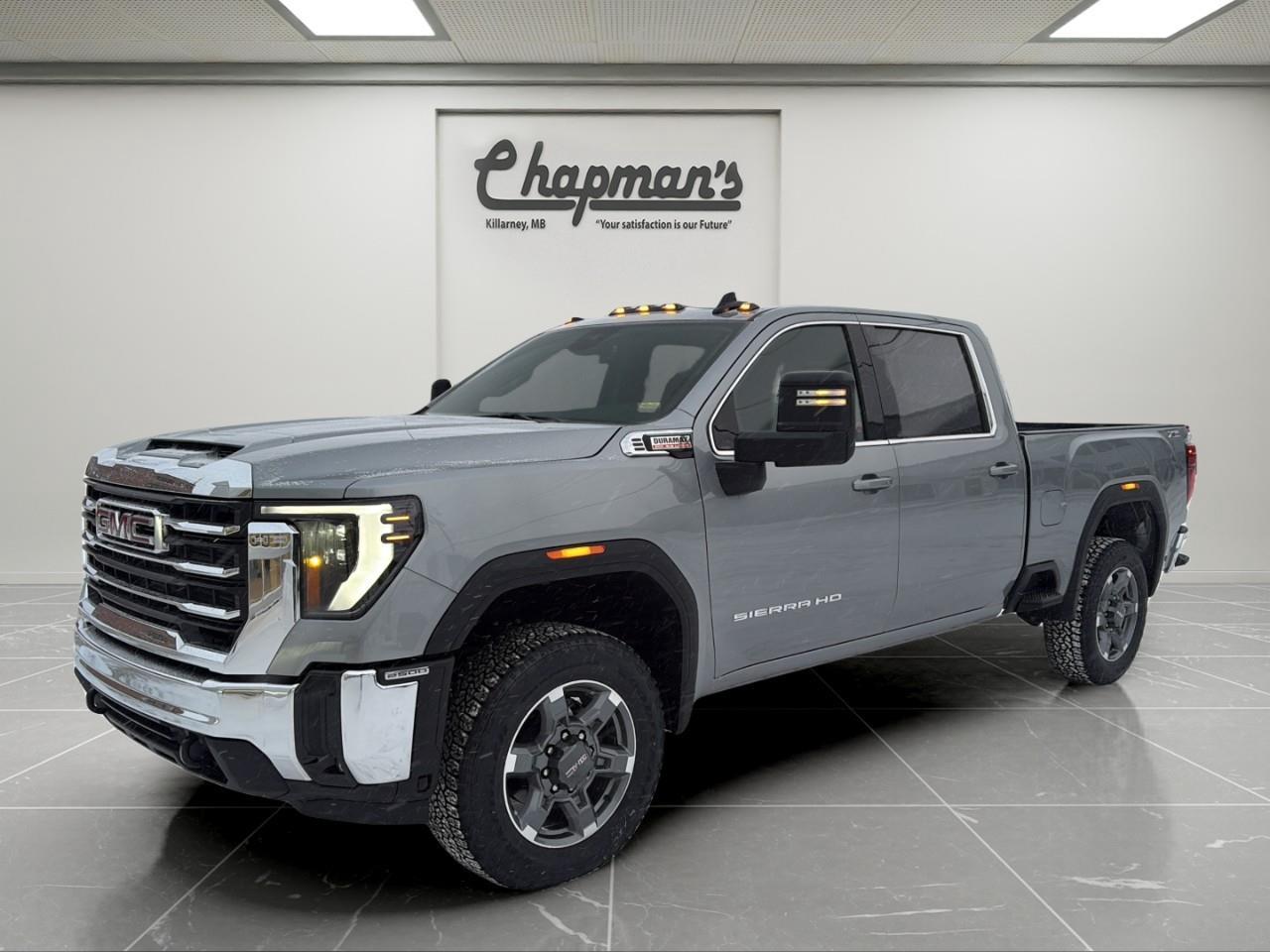 <p>The <strong>2026 GMC Sierra 2500 SLE Crew Cab 4WD</strong> delivers serious heavy-duty strength with everyday comfort and advanced technology. Finished in bold <strong>Sterling Metallic</strong> with a <strong>Jet Black interior</strong>, this Sierra combines work-ready durability with refined GMC styling.</p><p>Under the hood is the legendary <strong>Duramax 6.6L Turbo-Diesel V8</strong>, paired with a smooth-shifting <strong>10-speed automatic transmission</strong>, giving you massive torque for towing, hauling, and highway cruising. With its <strong>4WD system</strong>, <strong>AutoTrac two-speed transfer case</strong>, and <strong>X31 Off-Road Package</strong>, this truck is ready for job sites, gravel roads, winter highways, and off-the-grid adventures.</p><h3><strong>Heavy-Duty Performance & Capability</strong></h3><ul><li><p><strong>Duramax 6.6L Turbo-Diesel V8</strong></p></li><li><p><strong>10-Speed Automatic Transmission</strong></p></li><li><p><strong>AutoTrac Two-Speed Transfer Case</strong></p></li><li><p><strong>Automatic Locking Rear Differential</strong></p></li><li><p><strong>GVWR: 9,900 lbs (4,490 kg)</strong></p></li><li><p><strong>Trailer Brake Controller</strong></p></li><li><p><strong>Trailering Package with Hitch Guidance</strong></p></li><li><p><strong>In-Vehicle Trailering App & Hitch View</strong></p></li><li><p><strong>Gooseneck / 5th-Wheel Prep Package</strong></p></li><li><p><strong>High Idle Switch</strong></p></li><li><p><strong>Heavy-Duty Air Filter, Engine Oil Cooler & Transmission Oil Cooler</strong></p></li></ul><h3><strong>X31 Off-Road & Protection Package</strong></h3><ul><li><p><strong>Off-Road Suspension with Rancho Shocks</strong></p></li><li><p><strong>Hill Descent Control</strong></p></li><li><p><strong>Skid Plates</strong></p></li><li><p><strong>X31 Fender Badging</strong></p></li><li><p><strong>All-Weather Floor Liners</strong></p></li></ul><h3><strong>Interior Comfort & Convenience</strong></h3><p>Designed for long days and long drives:</p><ul><li><p><strong>Heated Driver & Front Passenger Seats</strong></p></li><li><p><strong>Heated Steering Wheel</strong></p></li><li><p><strong>10-Way Power Driver Seat</strong></p></li><li><p><strong>Dual-Zone Automatic Climate Control</strong></p></li><li><p><strong>40/20/40 Front Bench Seat with Lockable Under-Seat Storage</strong></p></li><li><p><strong>Rear Sliding Power Window</strong></p></li><li><p><strong>Remote Vehicle Start</strong></p></li><li><p><strong>Universal Home Remote</strong></p></li><li><p><strong>120-Volt Power Outlets (Cab & Cargo Bed)</strong></p></li><li><p><strong>12.3" Digital Driver Information Centre</strong></p></li></ul><h3><strong>Technology & Connectivity</strong></h3><ul><li><p><strong>13.4" GMC Premium Infotainment System with Google Built-In & Navigation Capability</strong></p></li><li><p><strong>Wireless Apple CarPlay & Android Auto</strong></p></li><li><p><strong>SiriusXM Audio (Trial Included)</strong></p></li><li><p><strong>OnStar Basics (up to 8 years)</strong></p></li><li><p><strong>HD Rear Vision Camera</strong></p></li><li><p><strong>Keyless Open & Start</strong></p></li></ul><h3><strong>Safety & Driver Assistance</strong></h3><p>Standard <strong>Sierra HD Pro Safety</strong> includes:</p><ul><li><p><strong>Automatic Emergency Braking</strong></p></li><li><p><strong>Forward Collision Alert</strong></p></li><li><p><strong>Front Pedestrian Braking</strong></p></li><li><p><strong>Lane Departure Warning</strong></p></li><li><p><strong>Following Distance Indicator</strong></p></li><li><p><strong>IntelliBeam Automatic High Beams</strong></p></li><li><p><strong>Buckle to Drive</strong></p></li></ul><h3><strong>Exterior Highlights</strong></h3><ul><li><p><strong>20" Bright Face Aluminum Wheels with Dark Painted Pockets</strong></p></li><li><p><strong>All-Terrain Tires</strong></p></li><li><p><strong>Power-Adjustable, Heated & Power-Folding Trailering Mirrors</strong></p></li><li><p><strong>Spray-On Bedliner</strong></p></li><li><p><strong>LED Cargo Bed Lighting</strong></p></li><li><p><strong>EZ-Lift Power Lock & Release Tailgate with Hitch Area Light</strong></p></li><li><p><strong>Integrated BedStep & CornerStep Rear Bumper</strong></p></li><li><p><strong>Chrome Front & Rear Bumpers</strong></p></li><li><p><strong>LED Roof Marker Lamps</strong></p></li></ul><h3><strong>Why Choose This Sierra 2500 SLE</strong></h3><p>With its <strong>Duramax diesel muscle</strong>, <strong>X31 off-road hardware</strong>, <strong>5th-wheel/gooseneck prep</strong>, <strong>advanced trailering technology</strong>, and <strong>heated, tech-rich interior</strong>, the <strong>2026 GMC Sierra 2500 SLE 4WD</strong> is built to work hard, tow big, and keep you comfortable doing it.</p><p>2 Year/24,000 kilometer* Complimentary Oil Changes (2 total)</p><p>3 Year/60,000 kilometer* Base Warranty Coverage</p><p>5 Year/100,000 kilometer* Powertrain Component Warranty Coverage</p><p>5 Year/100,000 kilometer* Courtesy Transportation and 24/7 Roadside Assistance</p><p>6 Year/160,000 kilometer* Sheet Metal (Rust Through) Perforation Warranty Coverage</p><p>*Whichever Comes First.</p><p>Price Includes HD Flaps & 6 Tube Steps.</p><p>Price Includes Dealer Fee.</p><p>Price Excludes PST & GST.</p><p>Financing Options Available, Call For More Details.</p> <p><strong>*While every reasonable effort is made to ensure the accuracy of this information, we are not responsible for any error or omissions contained on these pages. Please verify any information in question with Chapman Motors Ltd.</strong></p>