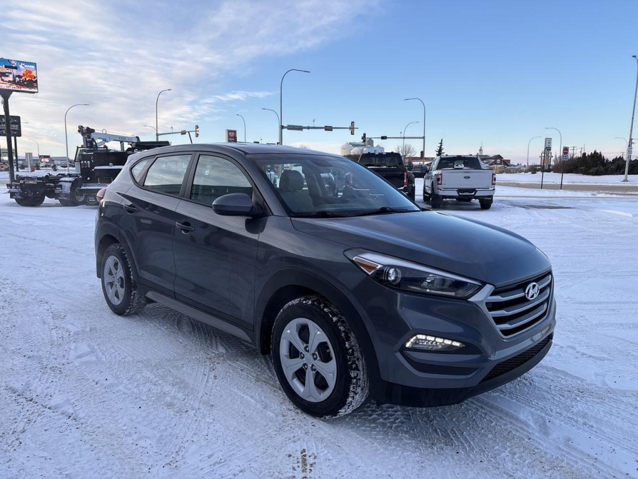 THE PRICE YOU SEE, PLUS GST. GUARANTEED!2.0 LITER ENGINE, 6 SPEED AUTO, REMOTE START, WINTER TIRES/RIMS INCLUDED.***FRONT WHEEL DRIVE***     The 2017 Hyundai Tucson SE with the 2.0-liter engine is a compact SUV that offers a well-rounded combination of performance, comfort, and value. Powered by a 2.0-liter four-cylinder engine, it produces around 164 horsepower and 151 lb-ft of torque, providing adequate acceleration and responsive driving dynamics for daily commuting and family outings. The SE trim typically comes equipped with features such as a six-speed automatic transmission, front-wheel drive, and a comfortable ride quality. Inside, the Tucson SE offers a user-friendly interior with standard amenities like a rearview camera, Bluetooth connectivity, a touchscreen infotainment system, and cloth upholstery, making it a practical choice for those seeking reliability and convenience. Its safety features often include stability control, antilock brakes, and multiple airbags, contributing to its solid safety record. The vehicles exterior design is modern and sporty, with a distinctive grille and sleek lines that give it an appealing appearance. Overall, the 2017 Hyundai Tucson SE with the 2.0-liter engine is recognized for its affordability, efficient fuel economy, and versatile performance, making it a popular choice in the compact SUV segment.Do you want to know more about this vehicle, CALL, CLICK OR COME ON IN!*AMVIC Licensed Dealer; CarFax and Full Mechanical Inspection Included.