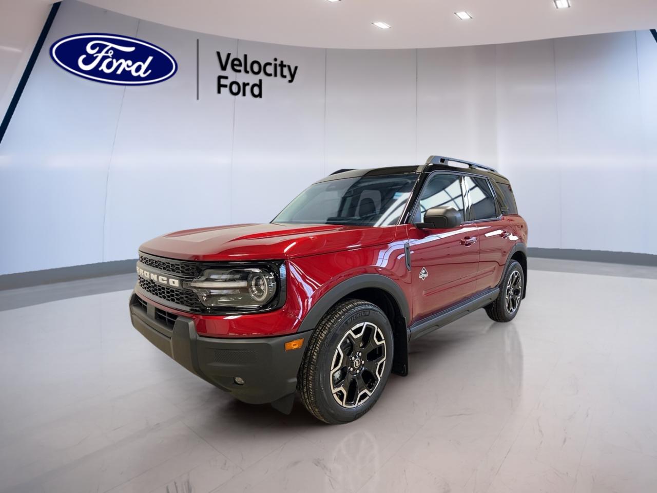 Experience adventure and comfort in the brand new 2025 Ford Bronco Sport Outer Banks, now available at Velocity Ford in Moose Jaw. Showcasing a bold red exterior paired with a refined brown interior, this SUV is engineered for those who appreciate both rugged capability and everyday practicality. Powered by a fuel-efficient 1.5-litre EcoBoost gas engine and an 8-speed automatic transmission, the Bronco Sport Outer Banks is ready for city streets or weekend getaways. 

FEATURES OF THE Bronco Sport Outer Banks  
»» Signature red exterior for standout presence  
»» Brown interior for a warm, inviting cabin  
»» Engine block heater for reliable cold starts  
»» 8-speed automatic transmission for smooth driving  

ADVANCED SAFETY FEATURES  
»» Comprehensive airbag system for occupant protection  
»» Rear-view camera for confident reversing  
»» Stability control for enhanced handling  
»» Anti-lock braking system for secure stops  

PERFORMANCE AND EFFICIENCY  
»» 1.5-litre EcoBoost engine for responsive power  
»» 8-speed automatic for seamless gear shifts  
»» Engine block heater for winter readiness  
»» Gasoline engine for balanced performance  

COMFORT AND CONVENIENCE  
»» Spacious seating for up to five passengers  
»» Easy-to-clean interior surfaces  
»» Ample legroom for front and rear occupants  
»» User-friendly controls within easy reach  

TECHNOLOGY AND CONNECTIVITY  
»» Modern infotainment system for entertainment  
»» USB ports for device charging  
»» Bluetooth connectivity for hands-free calls  
»» Digital driver display for key information  

CARGO SPACE  
»» Flexible rear cargo area for gear or groceries  
»» Split-folding rear seats for added versatility  
»» Wide rear hatch for easy loading  
»» Multiple storage compartments throughout cabin  

WHAT OTHER OWNERS LIKE  
»» Efficient EcoBoost engine for daily driving  
»» Practical cargo space for active lifestyles  
»» Comfortable ride quality on various terrains  
»» Distinctive design and colour options  

This 2025 Ford Bronco Sport Outer Bankss VIN is: 3FMCR9CN8SRF64203.