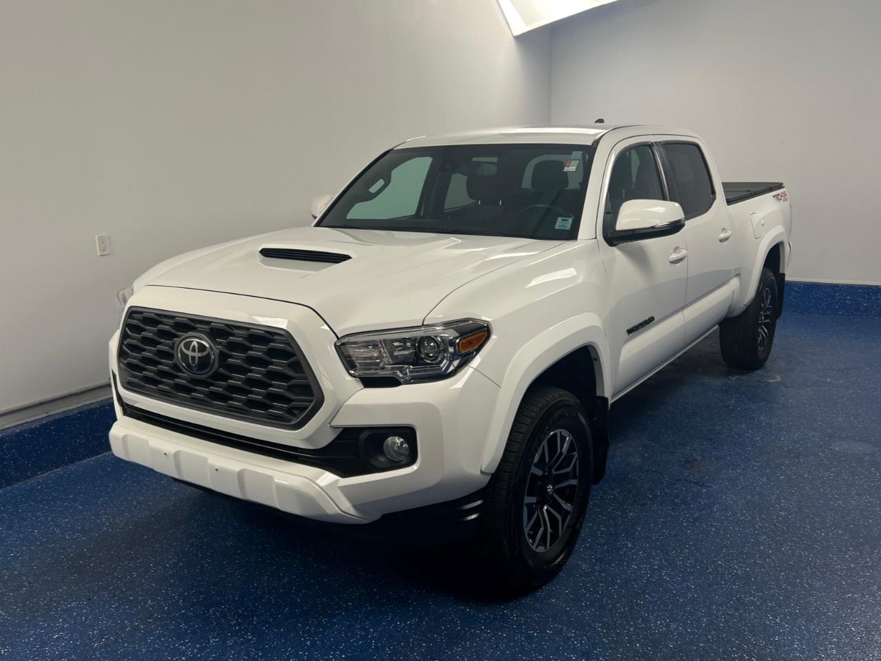 New Price! 2022 Toyota Tacoma Base V6 Crew Cab | TRD Sport | Zacks Certified. 6-Speed Automatic 4WD White 3.5L V6 DOHC 24V LEV3-ULEV70 278hp<br />Odometer is 34600 kilometers below market average!<br /><br />4WD, 17''' Alloy Wheels, 400 Watt (120V) Cargo Bed Power Outlet, 8-Way Power Adjustable Driver Seat, Anti-Theft Alarm System, Apple CarPlay/Android Auto, Connected Services by Toyota, Dual Zone Automatic Climate Control, Electrochromic Rear-View Mirror, Exterior Parking Camera Rear, Heated Front Bucket Seats, Hood Scoop, Leather Wrapped Shift Knob, Leather Wrapped Steering Wheel, LED Daytime Running Lights, Navigation System, Power Sliding Rear Window, Power Windows w/Driver Auto Down/Up, Radio: Premium Audio w/Remote, Short Range Key Fob Remote Start, Sliding Sun Visors w/Illuminated Mirrors, Smart Key w/Push Button Start, Sport Tuned Shock Absorbers, Sport Tuned Suspension, Tacoma TRD Sport Package, Tilt steering wheel, Tire Pressure Monitoring System, TRD Grade Fabric Seat Trim.<br /><br />Certification Program Details: Fresh 2 Yr MVI | 30 day warranty* | 110 point inspection | Full tank of fuel | Krown rustproofed | Flexible financing options | Professionally detailed<br /><br />This vehicle is Zacks Certified! You're approved! We work with you. Together we'll find a solution that makes sense for your individual situation. Please visit us or call 902 843-3900 to learn about our great selection.<br />Awards:<br /> * ALG Canada Residual Value Awards, Residual Value Awards * ALG Canada Residual Value Awards<br />With 22 lenders available Zack's Auto Sales can offer our customers with the lowest available interest rate. Thank you for taking the time to check out our selection!