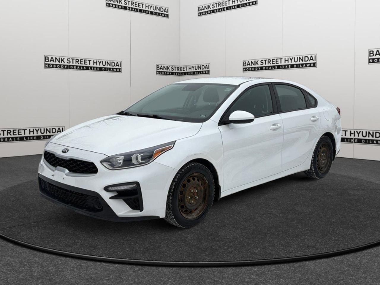 Experience the practicality and style of the 2020 Kia Forte LX in a crisp white finish with front-wheel drive, ensuring smooth handling and confidence on the road. This stunning sedan promises a blend of modern design and comfort for its passengers. Externally, the white hue gives it a fresh and refined look, perfect for any setting. Step inside to find an interior designed for comfort and convenience, featuring air conditioning and heated seats to keep you relaxed during your journeys. The smart device integration and Bluetooth connection ensure that you remain seamlessly in touch with your digital world. The Forte LX boasts impressive technology, including a backup camera to assist with parking, keyless entry for easy access, and power windows for your convenience. With safety in mind, features like brake assist and cruise control contribute to a safe and stable ride. If youre seeking an ideal mix of efficiency, comfort, and advanced features, the 2020 Kia Forte LX might be the perfect choice for you. Reach out to our dealership today to learn more about this exciting vehicle and to explore your purchasing options.