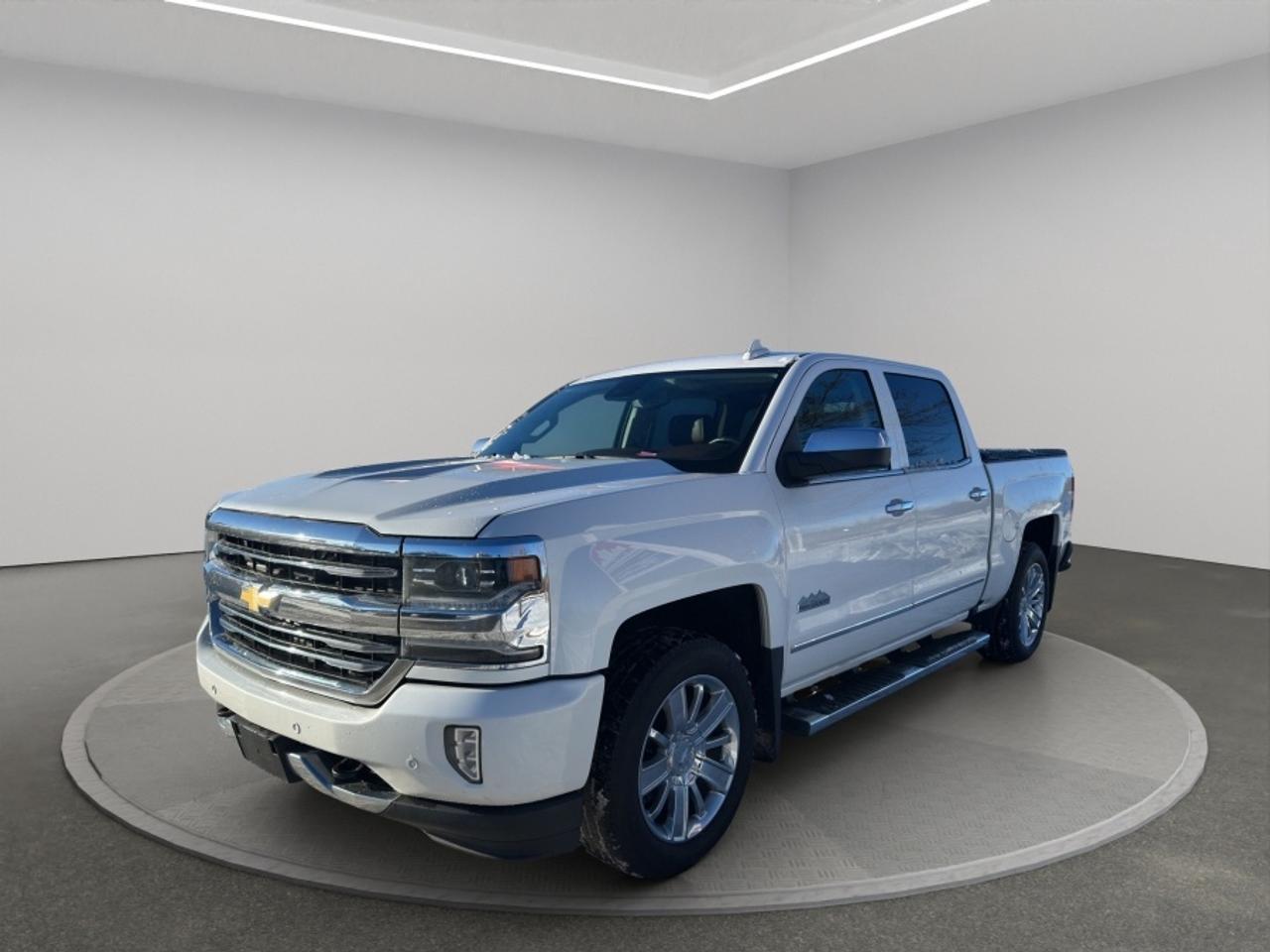 <p>HIGH COUNTRY = Top of the line, not LT. Factory brown perforated leather  heated & ventilated front seats  heated rear  Bose premium  wireless charging  sunroof  navigation  front & rear park assist  spray liner  chrome High Country grille. 5.3L V8 / 4WD Crew Cab  211,650 km Ontario truck  Stock #298667  VIN 3GCUKTEC1JG298667 Clean Carfax  Non-smoker  No stories.</p><p>$20,995 + HST & Licensing  Certification available for $799 extra  Top Notch Auto Sales Inc 5455 Steeles Ave W North York 416-879-7113<span id=jodit-selection_marker_1787424363795_29642361053882016 data-jodit-selection_marker=start style=line-height: 0; display: none;></span><br></p><p>Discover the remarkable blend of power, luxury, and versatility in this <strong>2018 Chevrolet Silverado 1500 High Country</strong>, now offered at Topnotch Auto Sales Inc. This flagship model represents the pinnacle of the Silverado lineup, perfect for those seeking a balance of rugged capability and upscale features. With its commanding presence, the High Country edition is designed for drivers who demand more from their full-size pickup, whether for demanding work tasks, weekend adventures, or everyday comfort.</p><p><br></p><p>If you need a truck thats as proficient at towing and hauling as it is comfortable on long drives or daily commutes, the Silverado High Country delivers the uncompromising performance and refinement you need. Built to handle tough jobs and diverse driving conditions, this Silverado is ready to take on any challenge with strength and style.</p><p><br></p><p><br></p><h2>Performance & Capability</h2><p><br></p><p>Beneath the hood of the High Country is a robust V8 engine, expertly matched to an 8speed automatic transmission, ensuring unmatched power and smooth, efficient performance. The advanced fourwheeldrive system empowers you to confidently face diverse terrain and Canadian weather, from job sites to highways to backcountry roads.</p><p><br></p><p><strong>Performance Highlights:</strong></p><p><br></p><ul><li><br></li><li>Powerful V8 engine providing exceptional horsepower and torque for all your driving and hauling needs</li><li><br></li><li>8speed automatic transmission offering seamless gear changes for a responsive drive</li><li><br></li><li>Advanced FourWheel Drive (4WD) system for off-road capability and year-round confidence</li><li><br></li><li>Impressive towing and payload ratings for trailers, boats, and more</li><li><br></li><li>Stable, confident handling to keep you in control no matter the load</li><li><br></li></ul><p><br></p><p><br></p><h2>Interior Comfort & Features</h2><p><br></p><p>Step inside the refined cabin of the Silverado High Country and youll be greeted by premium finishes, advanced comfort amenities, and class-leading space. The sophisticated interior is meticulously crafted to make every journey enjoyable, whether youre behind the wheel or riding along.</p><p><br></p><p><strong>Interior Highlights:</strong></p><p><br></p><ul><li><br></li><li>Luxurious leathertrimmed seating with premium stitching throughout</li><li><br></li><li>Heated and ventilated front seats for year-round comfort</li><li><br></li><li>Heated steering wheel for additional cold-weather convenience</li><li><br></li><li>Spacious five-passenger seating for comfort on short trips and long hauls</li><li><br></li><li>Generous cargo bedperfect for transporting tools, gear, or recreational equipment</li><li><br></li></ul><p><br></p><p>The High Country trim ensures every drive feels first-class, offering the perfect environment for work, family outings, or weekend getaways.</p><p><br></p><p><br></p><h2>Technology & Connectivity</h2><p><br></p><p>Stay effortlessly connected and entertained thanks to Chevrolets suite of cutting-edge technology features integrated into the Silverado High Country. Designed for modern drivers, this truck puts control, convenience, and connectivity right at your fingertips.</p><p><br></p><p><strong>Technology Features:</strong></p><p><br></p><ul><li><br></li><li>Intuitive infotainment system with vibrant colour display</li><li><br></li><li>Bluetooth® handsfree connectivity for calls and audio streaming</li><li><br></li><li>Seamless Apple CarPlay and Android Auto compatibility</li><li><br></li><li>Multiple USB charging ports to keep your devices powered on the go</li><li><br></li><li>Available premium Bose audio system for a concert-like listening experience (availability may vary)</li><li><br></li></ul><p><br></p><p><br></p><h2>Safety & Driver Confidence</h2><p><br></p><p>Chevrolet places your safety at the forefront, equipping the Silverado High Country with advanced driver assistance and protective technologies. No matter where your journeys take you, you can drive with confidence knowing you have comprehensive safety features at your side.</p><p><br></p><p><strong>Safety Highlights:</strong></p><p><br></p><ul><li><br></li><li>Rearview backup camera for easier reversing and parking</li><li><br></li><li>Stability and traction control to enhance confidence in challenging conditions</li><li><br></li><li>Comprehensive airbag system for occupant protection</li><li><br></li><li>Reliable antilock braking system (ABS) for safer stopping</li><li><br></li></ul><p><br></p><p>Drive assured that the Silverado High Country is engineered with your well-being in mind, combining advanced safety with robust build quality.</p><p><br></p><p><br></p><h2>Vehicle Condition</h2><p><br></p><p>This <strong>2018 Chevrolet Silverado 1500 High Country</strong> has undergone a complete professional inspection and meticulous detailing. Exceptionally well-maintained, it stands as a leading example of Chevrolets top-tier pickup, ready for many more journeys with its next proud owner.</p><p><br></p><p><br></p><h2>Why Buy from Topnotch Auto Sales Inc?</h2><p><br></p><p>With over 14 years of dedicated automotive experience, Topnotch Auto Sales Inc is your trusted source for quality preowned vehicles. We are committed to providing transparent service, a relaxed buying environment, and expert guidance at every step. Our knowledgeable staff is here to ensure your satisfaction and confidence in every purchase you make.</p><p><br></p><p><br></p><h2>Flexible Financing Options</h2><p><br></p><p>No matter your credit history, we have solutions that work for you:</p><p><br></p><p> Bad Credit</p><p><br></p><p> Limited Credit</p><p><br></p><p> Past Financial Challenges</p><p><br></p><ul><li><br></li><li>Quick and easy approvals for peace of mind</li><li><br></li><li>Sameday decisions to get you on the road fast</li><li><br></li><li>Low down payment options to fit your budget</li><li><br></li></ul><p><br></p><p><br></p><h2>Certification Option</h2><p><br></p><p>For added reassurance, we offer certification for <strong>$799</strong>, ensuring your vehicle complies with all Ontario provincial safety standards for worry-free driving.</p><p><br></p><p><br></p><h2>OMVIC Compliance Notice</h2><p><br></p><p>As per OMVIC regulations, all vehicles are sold <strong>asis</strong> unless certified. Our friendly team will guide you through the certification process and answer any questions you may have.</p><p><br></p><p><br></p><p> <strong>Visit Us At:</strong></p><p><br></p><p>5455 Steeles Ave W, North York, ON M9L 1S7</p><p><br></p><p> <strong>Call or Text:</strong></p><p><br></p><p>4168797113</p>