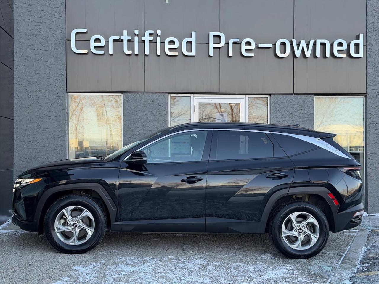 This LOW KM Hyundai Tucson TREND comes loaded with a fuel efficient and responsive 2.5L motor, automatic transmission with selectable drive modes, an amazing HTRAC ALL WHEEL DRIVE system with multi-terrain modes, PANORAMIC ROOF, SMART power liftgate, heated black leather seats with power drivers seat, LED daytime running lights, alloy wheels, automatic LED headlights, 10.25-inch touchscreen with NAVIGATION / APPLE CARPLAY / ANDROID AUTO, Bluetooth phone & audio connectivity, 60/40 split folding rear seats, Hyundais Bluelink, proximity key with push start ignition, heated leather wrapped steering wheel, dual-zone automatic climate control, Forward Collision Avoidance Assist, Lane Follow Assist, Lane Departure Warning, Lane Keep Assist, High Beam Assist, Blind Spot Detection system, rear-cross traffic collision assist, back-up camera and much more!!!