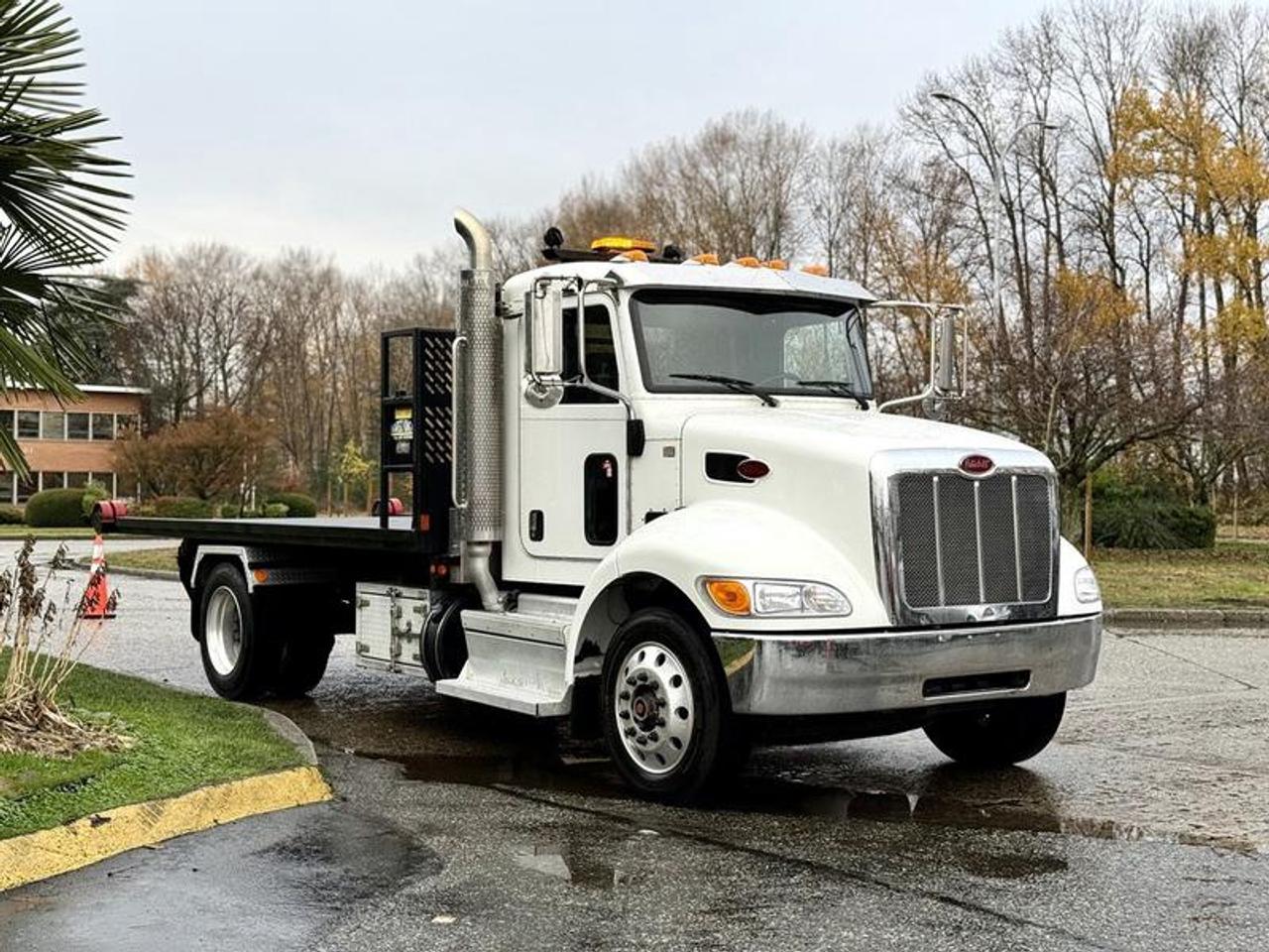 This 2020 Peterbilt 330 roll-off hook truck is equipped with a PX-7 6.7L 6-cylinder engine, automatic transmission and 4x2 driveline, and features a white exterior with a black vinyl interior. It includes a 16-foot flat deck rated at 12,000 lb capacity, hydraulic brakes, PTO, beacon light, air horn, regen switch, air suspension switch, auto idle shut down, heated mirrors, air-assisted driver seat, storage compartments, 12V inputs, air conditioning and heat, cruise control and an AM/FM radio, along with power windows, power door locks and power mirrors. The flat deck measures approximately 16 feet long and 8 feet 5 inches wide. Overall vehicle dimensions are about 26 feet 8 inches long, 8 feet 6 inches wide and 9 feet 10 inches high, with a GVWR of 11,794 kg (25,993 lb). This item is currently OFFSITE. You must register an appointment with our office to schedule an offsite viewing. Appointments must be made a minimum of one business day in advance (and as defined by the days that Repo.com is open for business) before your appointment can be scheduled and confirmed. We may, at our own discretion, instead opt to transport smaller items to Repo.coms main yard for viewing purposes.  $125,820.00 plus $375 processing fee, $126,195.00 total payment obligation before taxes.   Listing report, warranty, contract commitment cancellation fee, financing available on approved credit (some limitations and exceptions may apply). All above specifications and information is considered to be accurate but is not guaranteed and no opinion or advice is given as to whether this item should be purchased. We do not allow test drives due to theft, fraud, acts of vandalism and undetectable impaired driving. Instead we provide the following benefits: Complimentary Warranty (with options to extend), Limited Money Back Satisfaction Guarantee on Fully Completed Contracts, Contract Commitment Cancellation, and an Open-Ended Sell-Back Option. Ask seller for details or call 604-522-REPO(7376) to confirm listing availability.
