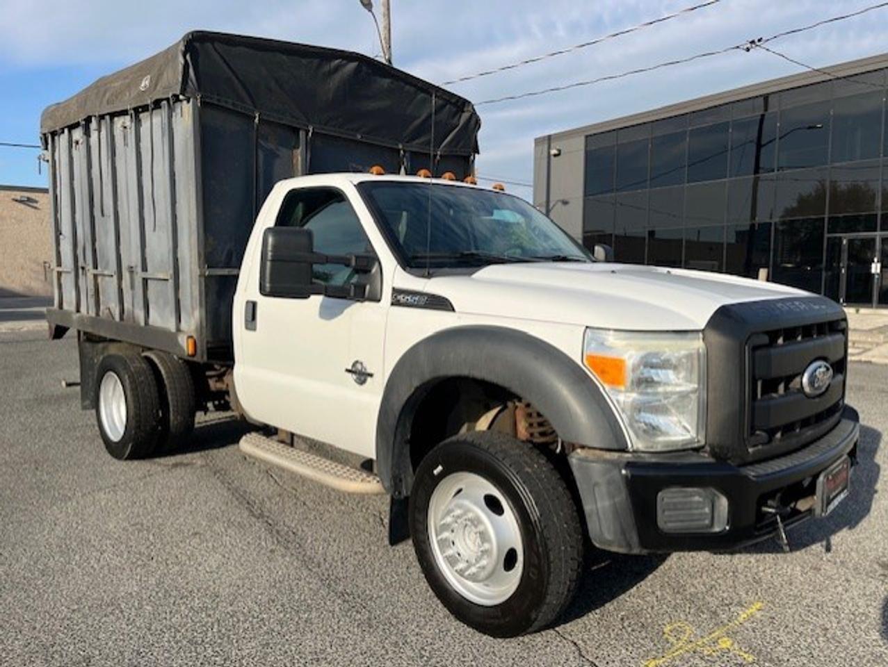 2011 Ford F-550 4WD 6.7L POWER STROKE DIESEL FLAT BED STAKE TRUCK! Photo