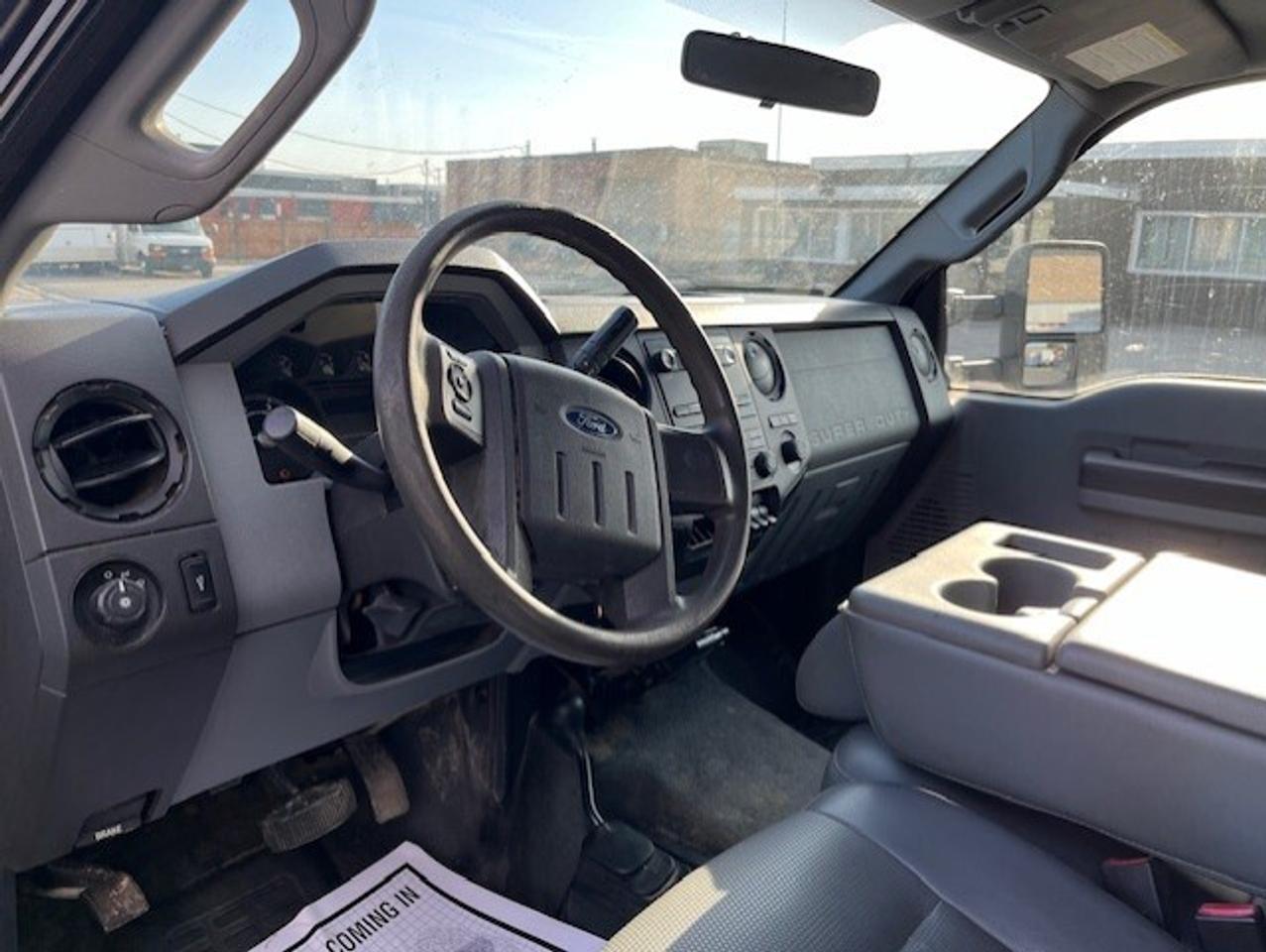 2011 Ford F-550 4WD 6.7L POWER STROKE DIESEL FLAT BED STAKE TRUCK! Photo