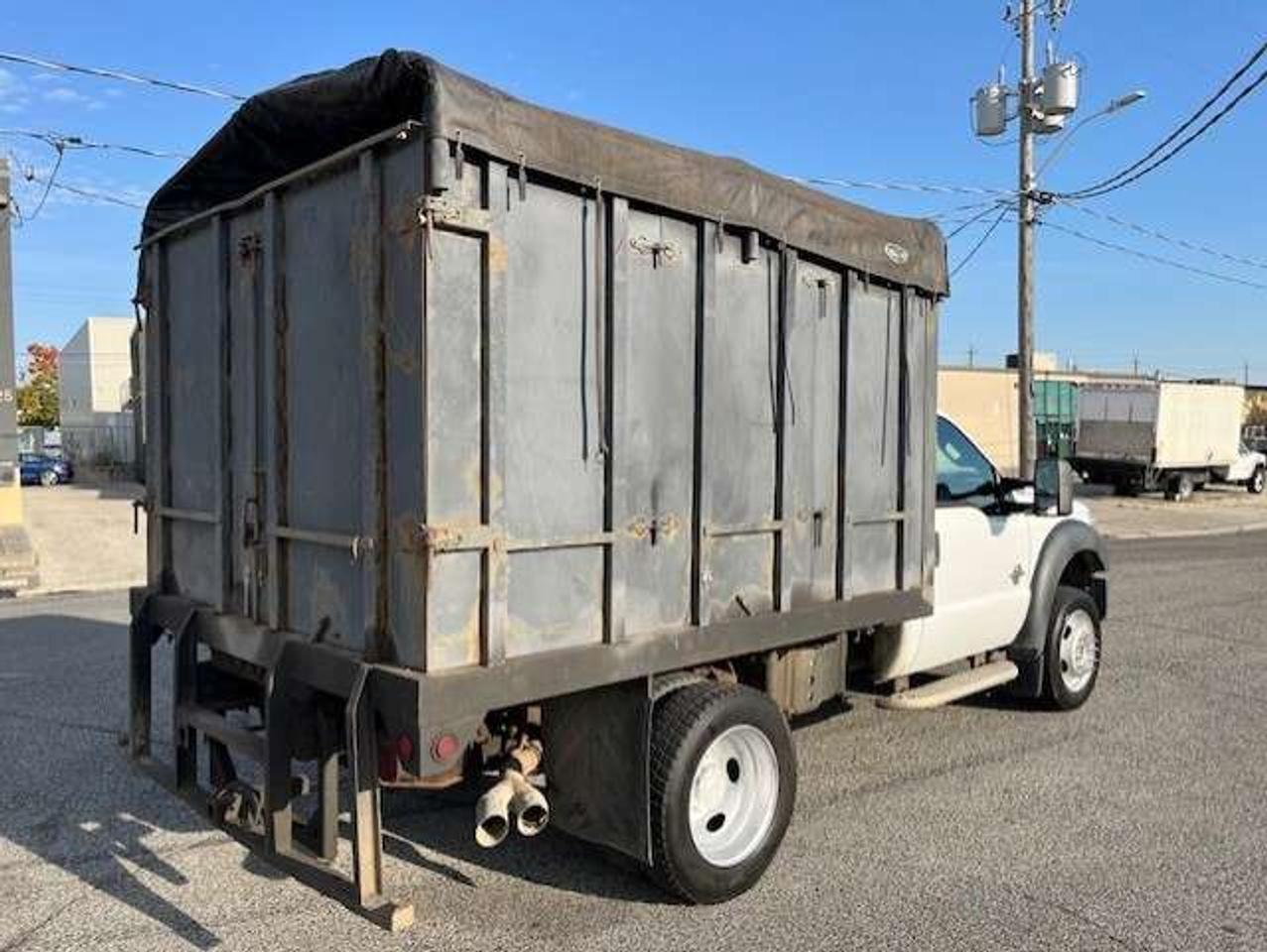 2011 Ford F-550 4WD 6.7L POWER STROKE DIESEL FLAT BED STAKE TRUCK! Photo