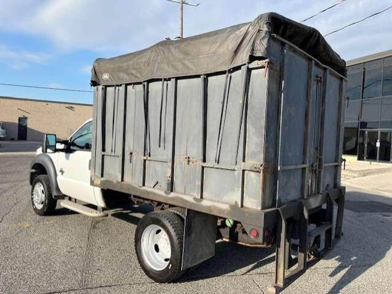 2011 Ford F-550 4WD 6.7L POWER STROKE DIESEL FLAT BED STAKE TRUCK! Photo