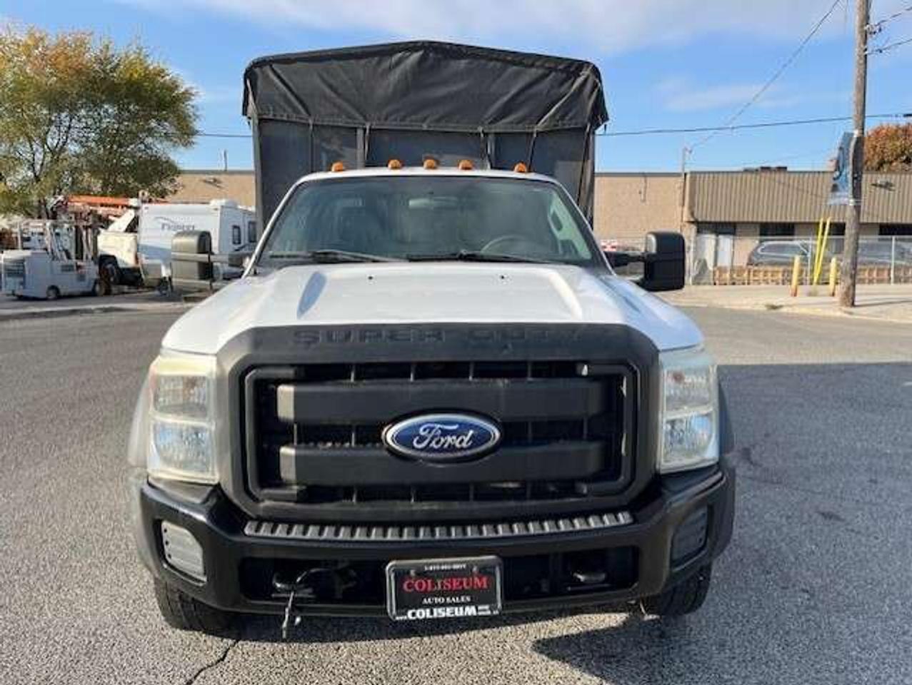 2011 Ford F-550 4WD 6.7L POWER STROKE DIESEL FLAT BED STAKE TRUCK! Photo
