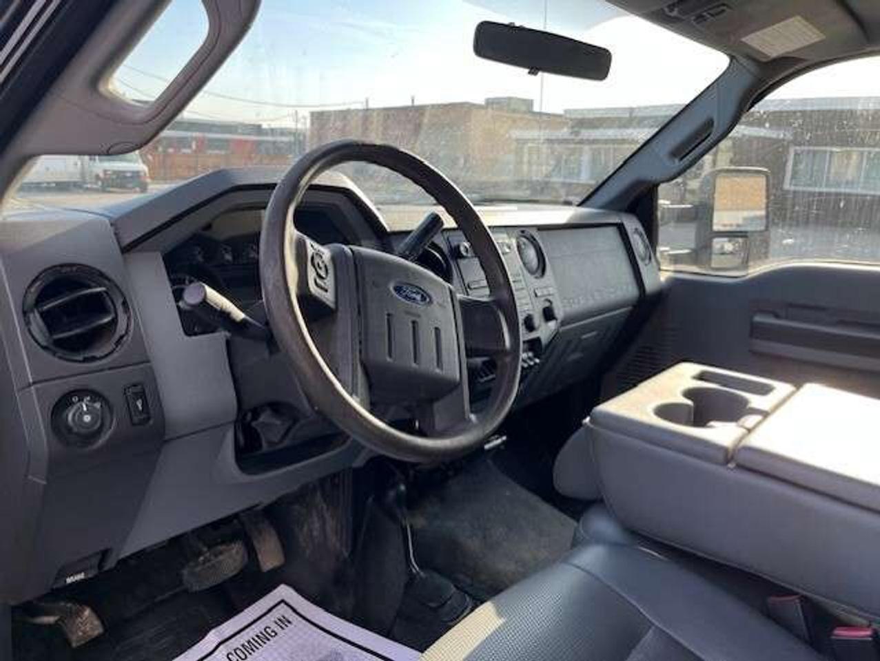 2011 Ford F-550 4WD 6.7L POWER STROKE DIESEL FLAT BED STAKE TRUCK! Photo