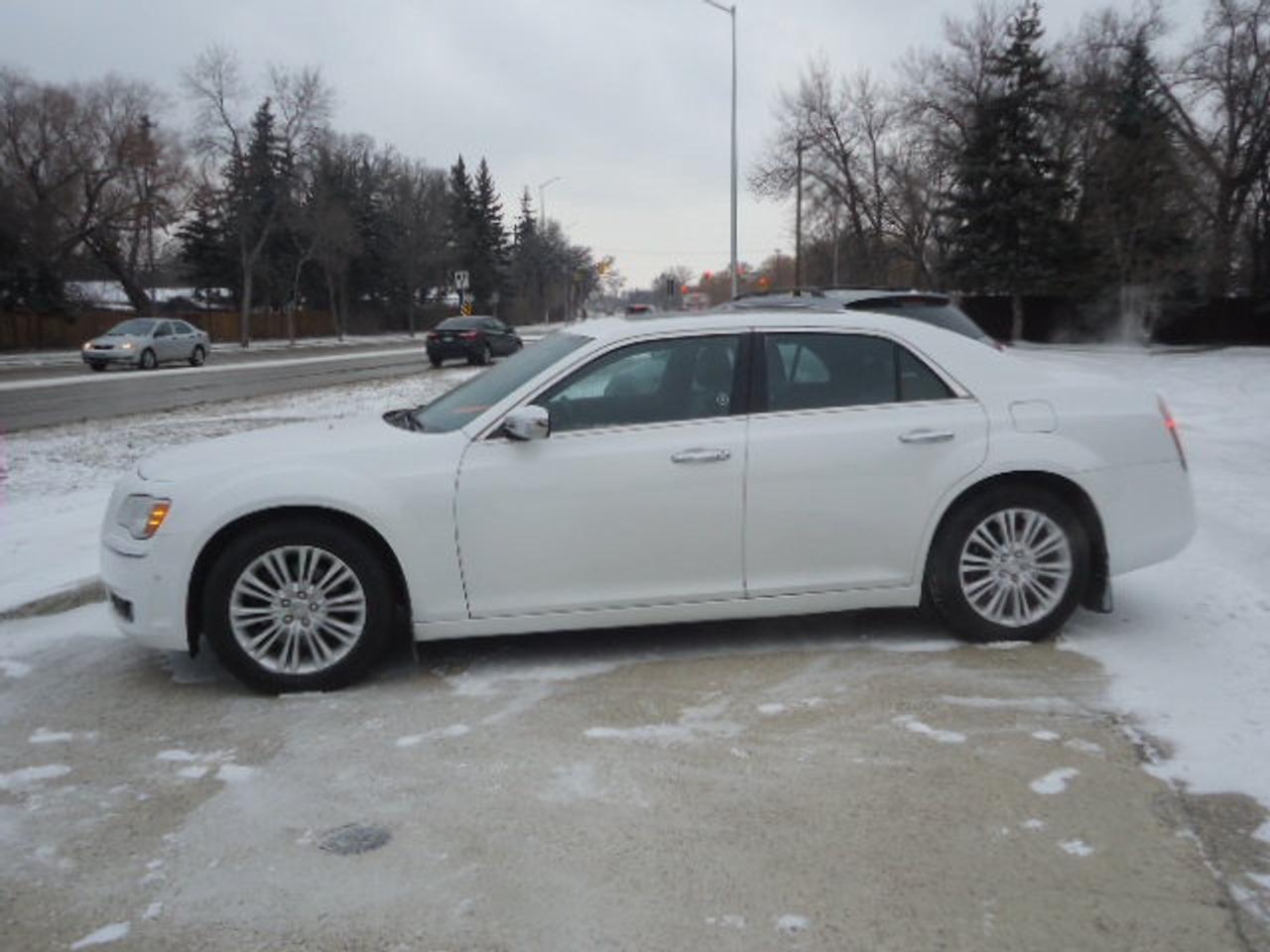 <p>SUPER CLEAN!! JUST TRADED IN @ OUR STORE!! 2014 CHRYSLER 300C AWD 5.7 LITRE V8 HEMI!! LOADED WITH ALL THE GOODIES!! 212 000 HIGHWAY KMS!! JUST SAFETIED AND SERVICED!! ON SALE NOW FOR ONLY $12,986 PLUS PST AND GST WARRANTY AND VARIOUS FINANCING OPTIONS AVAILABLE OAC. VIEW @ MOE DUPUIS ENTERPRISE INC. CONVENIENTLY LOCATED @ 1270 ARCHIBALD ST!! CELEBRATING 25 YEARS IN BUSINESS!! FOR YOUR PERSONAL APPT CALL BRYAN @ 204 256 5232 OR 204 941 9080 OR 24/7 @ WWW.MOEDUPUIS .CA DEALER #4194</p>