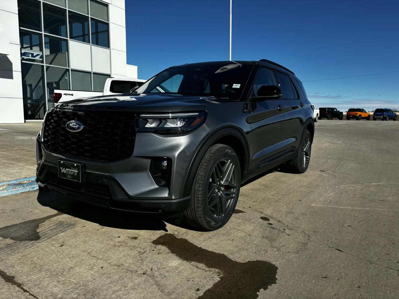 <p>Looking for a stylish and capable SUV thats ready for any adventure? Check out this brand-new 2026 Ford Explorer ST-Line 4WD, available now at Webbs 1441. This stunning SUV, painted in a sleek Carbonized Grey Metallic, is more than just a head-turner; its packed with features designed to elevate your driving experience.</p><p>This Explorer ST-Line is equipped with everything you need for both daily commutes and weekend getaways. With its powerful 2.3L EcoBoost engine and smooth 10-speed automatic transmission, youll enjoy a responsive and efficient drive, no matter the terrain. Plus, the 4-wheel drive system gives you the confidence to tackle those unpredictable Canadian winters. Inside, youll find a luxurious Onyx interior with leather seating, ensuring both comfort and style for you and your passengers.</p><p>Heres a taste of what makes this Explorer ST-Line so special:</p><ul><li><strong>BlueCruise Capability:</strong> Experience the future of driving with hands-free highway driving using the BlueCruise system.</li><li><strong>Panoramic Sunroof:</strong> Enjoy breathtaking views with the expansive panoramic sunroof.</li><li><strong>Heated Second-Row Seats:</strong> Keep your passengers cozy, even on the coldest days.</li><li><strong>ST-Line Street Pack:</strong> Includes performance tires, red performance brakes, and 21-inch aluminum wheels for a sporty and head-turning look.</li><li><strong>Advanced Connectivity:</strong> Stay connected with Fords advanced connectivity features.</li></ul><p><strong><em>Powered by AutoIntelligence&trade;</em></strong> Powered by AutoIntelligence&trade;</p>