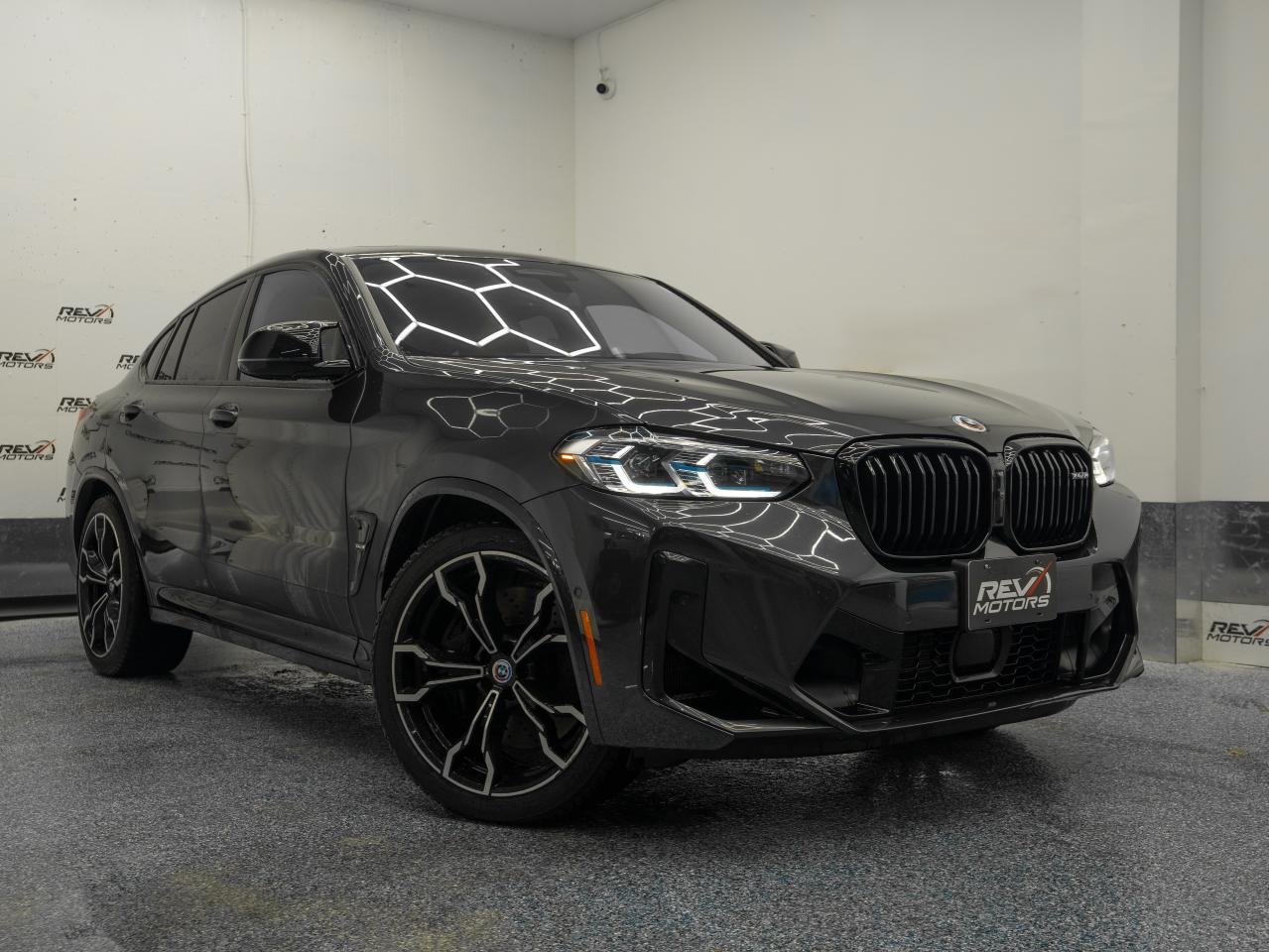 2023 BMW X4 M Competition | Panoramic Sunroof | Premium Pkg | M Drivers Pkg <br/> <br/> <br/> <br/> Dark Graphite Metallic Exterior | Sakhir Orange Leather Interior | 20-Inch M Double-Spoke Wheels | Keyless Entry | Carbon Fibre Trim | Panoramic Sunroof | Heated Front Seats | Apple CarPlay & Android Auto | Harman Kardon® Surround Sound | iDrive 7 Infotainment | Blind Spot Detection | Rear Cross-Traffic Alert | Adaptive Cruise Control | Lane-Keeping Assist | LED Headlights | Rearview Camera | Push Button Start | 8-Speed M Steptronic Transmission | 3.0L M TwinPower Turbo Inline-6 Engine | 473 Horsepower | M xDrive All-Wheel Drive | and much more. <br/> <br/> <br/> Manufacturer Packages Include: <br/> Premium Package (ZPP) - Includes Automatic Parking | Back-up Camera | Cooled Front Seats | Cross Traffic Alert | Heads-Up Display | Heated Front Seats | Heated Rear Seats | Rear Parking Aid | Aeriel View Disyplay System | rear Collision Mitigation <br/> M Drivers Packahe (7ME) <br/> Advanced Driver Assistance Package (ZKB) - Includes Adaptive Cruise Control | Cross Traffic Alert | Lane Departure Warning | Lane Keeping Assist | Driver MOnitoring | Cruise Control Sterring Assist | Front Collision Mitigation | Evasion ASsist <br/> Connected Package Professional <br/> <br/> <br/> <br/> <br/> The 2023 BMW X4 M blends track-inspired performance with premium comfort and standout styling, delivering an exhilarating driving experience in a sleek, coupe-like SUV design. <br/> <br/> <br/> Key Features: <br/> <br/> <br/> Striking & Athletic Design: <br/> With its aggressive M front fascia, sculpted lines, coupe-style roofline, and bold LED headlights, the X4 M commands attention. The Black Sapphire Metallic exterior adds a sleek, powerful presence on the road. <br/> <br/> <br/> Premium Red Interior: <br/> Step into a luxurious cabin finished in red Merino leather, complete with heated M sport seats, carbon-fiber accents, and BMWs signature driver-oriented layout. Every detail enhances comfort, performance, and style. <br/> <br/> <br/> Advanced Technology: <br/> Enjoy seamless connectivity with iDrive 7, a crisp touchscreen interface, wireless Apple CarPlay & Android Auto, a Harman Kardon® premium audio system, and customizable digital displays for a modern driving experience. <br/> <br/> <br/> Track-Inspired Performance: <br/> Powered by a 3.0L M TwinPower Turbo inline-6 delivering 473 horsepower, the X4 M offers explosive acceleration and precise power delivery. Paired with an 8-speed M Steptronic transmission and M xDrive AWD, it delivers exceptional traction, control, and handling in all conditions. <br/> <br/> <br/> Dynamic Handling: <br/> With adaptive M suspension, M sport brakes, and a finely tuned chassis, the X4 M provides sharp cornering, impressive stability, and a performance feel worthy of the M badge. <br/> <br/> <br/> Comprehensive Safety & Driver Assistance: <br/> Equipped with advanced safety featuresincluding blind spot detection, lane-keeping assist, adaptive cruise control, and rear cross-traffic alertthe X4 M ensures confidence on every drive. <br/> <br/> <br/> The 2023 BMW X4 M combines high-performance engineering, luxury craftsmanship, cutting-edge technology, and bold stylingperfect for drivers who want power and prestige in an SUV coupe format. <br/> <br/> <br/> This Vehicle Has Travelled 79,777 Kms. <br/> <br/> <br/> *** NO additional fees except for taxes and licensing! *** <br/> <br/> <br/> *** 100-point inspection on all our vehicles & always detailed inside and out *** <br/> <br/> <br/> RevMotors is at your service to ensure you find the right car for YOU. Even if we do not have it in our inventory, we are more than happy to find you the vehicle that you are looking for. Give us a call at 613-791-3000 or visit us online at www.revmotors.ca <br/> <br/> <br/> Ça nous donnera du plaisir de vous servir en Français aussi! <br/> <br/> <br/> CERTIFICATION * All our vehicles are sold Certified for the province of Ontario (Quebec Safety Available, additional charges may apply) <br/> FINANCING AVAILABLE * RevMotors offers competitive finance rates through many of the major banks. Should you feel like youve had credit issues in the past, we have various financing solutions to get you on the road. We accept No Credit - New Credit - Bad Credit - Bankruptcy - Students and more!! <br/> EXTENDED WARRANTY * For your peace of mind, if one of our used vehicles is no longer covered under the manufacturers warranty, RevMotors will provide you with a 6 month / 6000KMS Limited Powertrain Warranty. You always have the options to upgrade to more comprehensive coverage as well. Well be more than happy to review the options and chose the coverage thats right for you! <br/> TRADES * Do you have a Trade-in? We offer competitive trade in offers for your current vehicle! <br/> SHIPPING * We can ship anywhere across Canada. Give us a call for a quote and we will be happy to help! <br/> <br/> <br/> Buy with confidence knowing that we always have your best interests in mind! <br/>