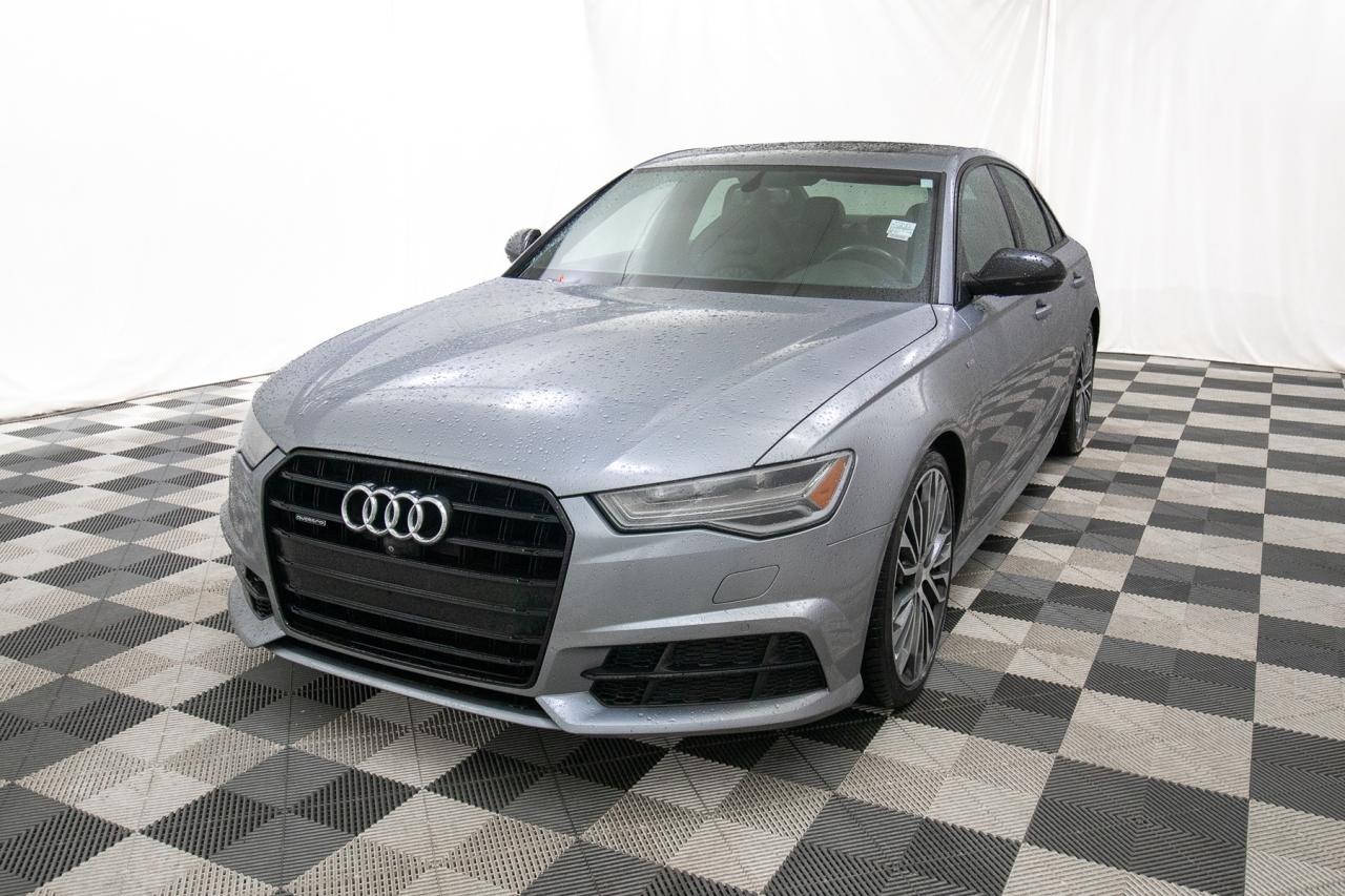 <p>Looking for a sophisticated and powerful sedan that turns heads? Feast your eyes on this stunning 2018 Audi A6 PROGRES/TECHNIK S-LINE, now available at Key West Ford! This meticulously maintained vehicle boasts a sleek design and a wealth of premium features, promising a driving experience thats both exhilarating and refined. With only 100,355 KM on the odometer, this Audi A6 is ready to provide years of luxurious driving pleasure.</p><p>&nbsp;</p><p>This Audi A6 is packed with features designed to elevate your driving experience. From its advanced technology to its luxurious interior, every detail has been carefully considered. The powerful 3.0 TFSI 6-cylinder engine delivers an impressive 340 horsepower, ensuring a thrilling ride every time you get behind the wheel. The S-LINE trim adds a sporty touch, while the PROGRES/TECHNIK package provides a host of premium amenities.</p><p>&nbsp;</p><p>Here are five features that will make you fall in love with this Audi A6:</p><p><br><br></p><ul><li><strong>Integrated Navigation System:</strong> Get where you need to go with ease, thanks to the integrated navigation system with voice activation.</li></ul><p>&nbsp;</p><ul><li><strong>Express Open/Close Sunroof:</strong> Enjoy the open air and sunshine with the touch of a button with the express open/close sliding and tilting glass sunroof.</li></ul><p>&nbsp;</p><ul><li><strong>Front and Rear Parking Sensors:</strong> Navigate tight spots with confidence, thanks to the front and rear parking sensors.</li></ul><p>&nbsp;</p><ul><li><strong>Wireless Phone Connectivity:</strong> Stay connected on the go with wireless phone connectivity.</li></ul><p>&nbsp;</p><ul><li><strong>Engine Auto Stop-Start Feature:</strong> Save fuel and reduce emissions with the engine auto stop-start feature.</li></ul><p><br><br></p><p>Visit Key West Ford today to experience the luxury and performance of this exceptional Audi A6 for yourself!</p><p>&nbsp;</p><p><strong><em>Powered by AutoIntelligence&trade;</em></strong><br>Vehicle information has been generated using artificial intelligence and is provided for informational purposes only. While efforts are made to ensure accuracy, please confirm all details directly with the dealer.</p><p>&nbsp;</p><p>Experience peace of mind with our Buy With Confidence program! This vehicle comes with a comprehensive mechanical and safety inspection, Carfax report, and full disclosure. We are committed to transparent pricing. The advertised price excludes fees: $699 Documentation, $349 Registration/Insurance Transfer, $695 Finance Administration Fee (if applicable), and taxes. As BCs #1 Volume Dealer and #1 for Customer Experience on DealerRater, we prioritize your satisfaction. See Key West Ford for complete details. Book your test drive today!&nbsp; Dealer #7485</p>