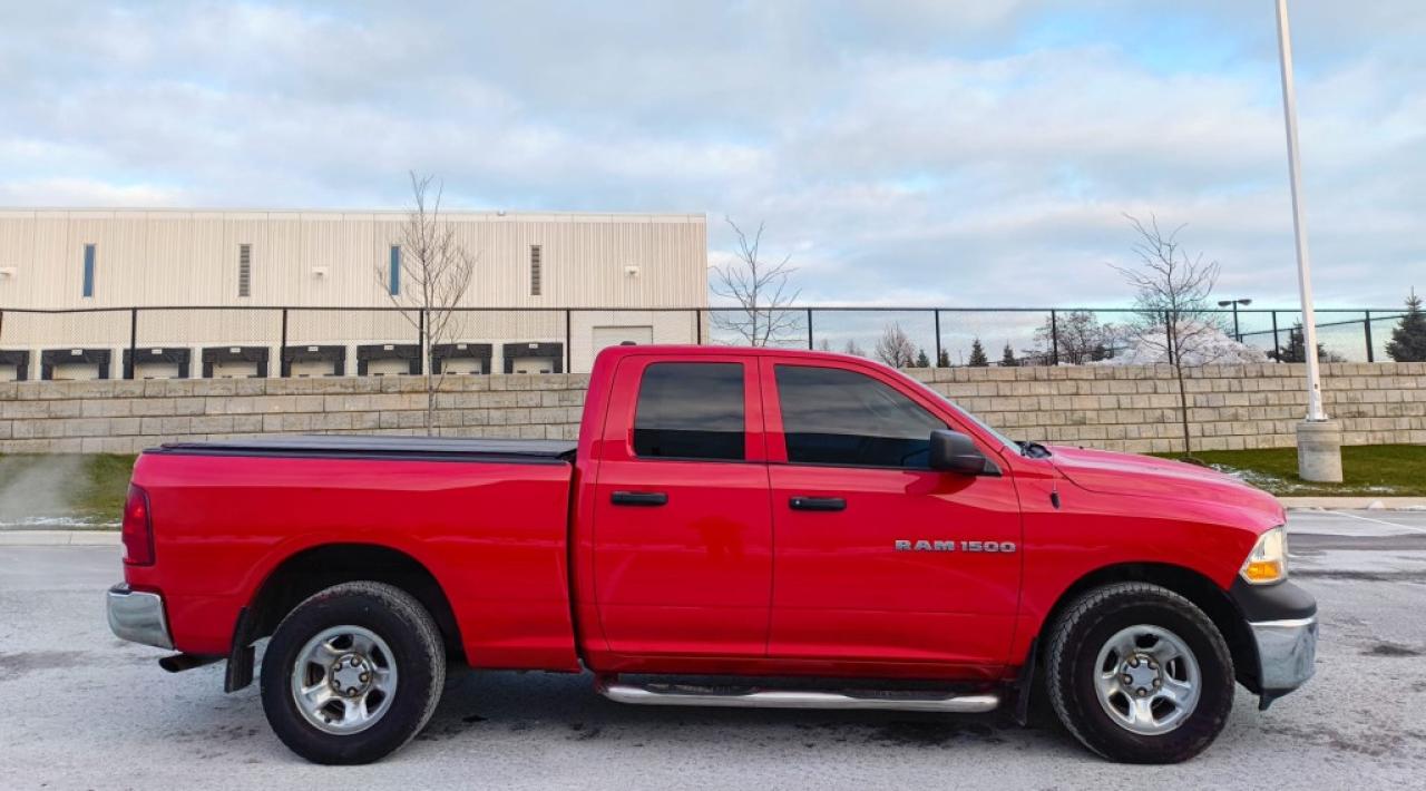 2011 RAM 1500 ST 4dr Quad Cab 4WD SB (4.7L 8cyl 5A) Photo