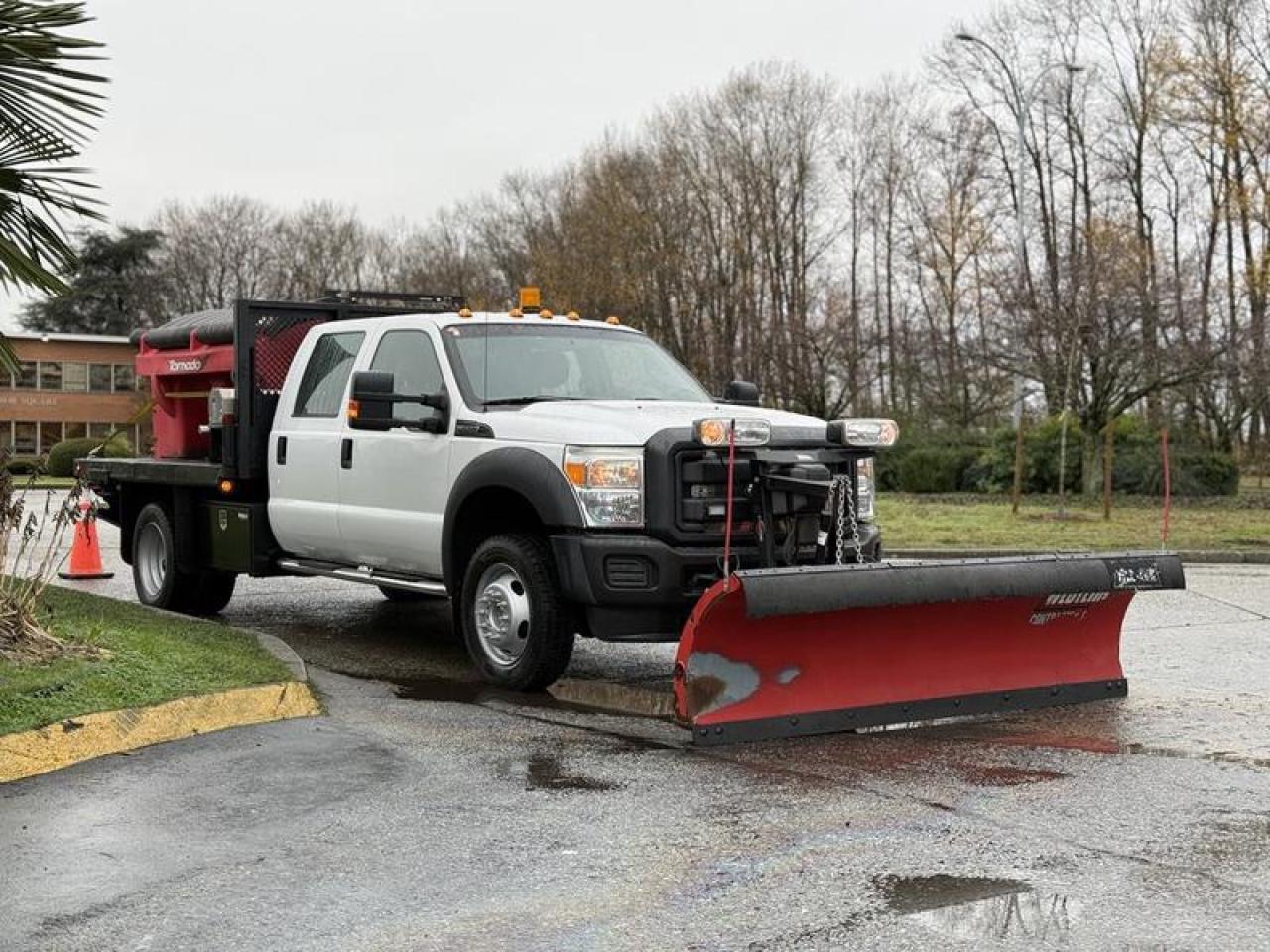 Used 2013 Ford F-550 Crew Cab 9-Foot Flat Deck Dump Truck with Plow and Sander for sale in Burnaby, BC