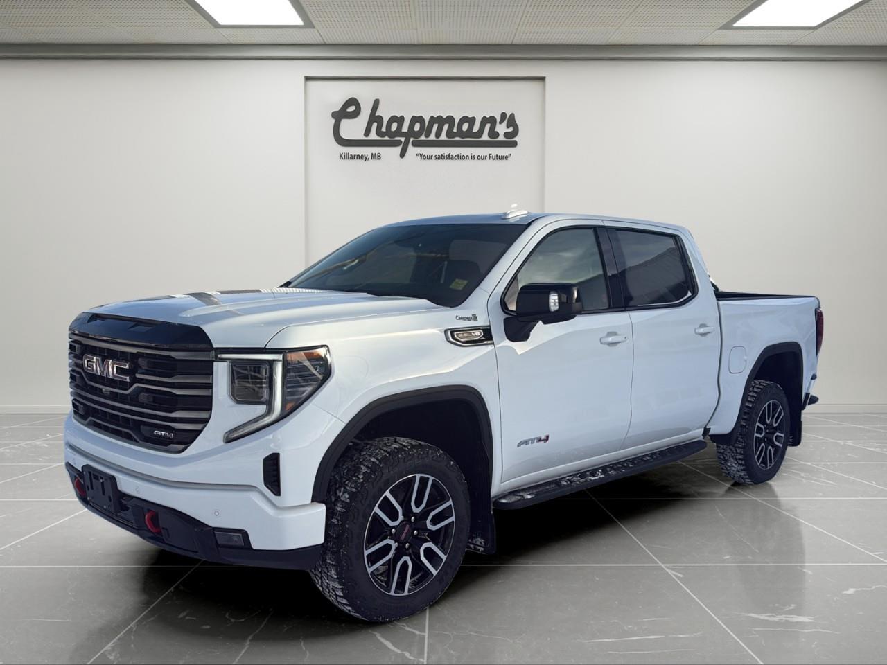 <p>The <strong>2026 GMC Sierra 1500 AT4 Crew Cab 4WD</strong> is built for drivers who want maximum power, true off-road hardware, and high-end comfort in one bold package. Finished in <strong>Summit White</strong> with a striking <strong>Jet Black / Kalahari interior</strong>, this AT4 delivers a rugged exterior with a refined, luxury-grade cabin.</p><p>Under the hood sits the formidable <strong>6.2L EcoTec3 V8</strong>, paired with a smooth <strong>10-speed automatic transmission</strong>, delivering exceptional horsepower, torque, and towing confidence. Add the <strong>AT4 2" factory lift</strong>, <strong>skid plates</strong>, and <strong>locking rear differential</strong>, and this Sierra is ready for trails, job sites, winter roads, and everything in between.</p><h3><strong>AT4 Performance & Off-Road Capability</strong></h3><ul><li><p><strong>6.2L EcoTec3 V8 Engine</strong></p></li><li><p><strong>10-Speed Automatic Transmission</strong></p></li><li><p><strong>2-Speed AutoTrac Transfer Case</strong></p></li><li><p><strong>Automatic Locking Rear Differential</strong></p></li><li><p><strong>AT4 Off-Road Suspension with 2" Factory Lift & Monotube Shocks</strong></p></li><li><p><strong>Skid Plates & Hill Descent Control</strong></p></li><li><p><strong>Trailer Brake Controller</strong></p></li><li><p><strong>120-Volt Power Outlets in Cab & Bed</strong></p></li></ul><h3><strong>AT4 Premium Interior</strong></h3><p>Built for comfort on long drives and tough terrain:</p><ul><li><p><strong>Heated & Ventilated Front Bucket Seats</strong></p></li><li><p><strong>Heated Second-Row Outboard Seats</strong></p></li><li><p><strong>10-Way Power Front Seats with Memory</strong></p></li><li><p><strong>Power Tilt & Telescoping Steering Column</strong></p></li><li><p><strong>Heated Leather-Wrapped Steering Wheel</strong></p></li><li><p><strong>Wireless Phone Charging</strong></p></li><li><p><strong>Bose Premium Audio System</strong></p></li><li><p><strong>Adaptive Cruise Control</strong></p></li><li><p><strong>Premium Floor Liners</strong></p></li></ul><h3><strong>Technology & Connectivity</strong></h3><p>A modern digital command centre:</p><ul><li><p><strong>13.4" GMC Premium Infotainment Touchscreen with Google Built-In & Navigation</strong></p></li><li><p><strong>Wireless Apple CarPlay & Android Auto</strong></p></li><li><p><strong>12.3" Digital Driver Information Centre</strong></p></li><li><p><strong>In-Vehicle Trailering App</strong></p></li><li><p><strong>OnStar Basics (up to 8 years)</strong></p></li><li><p><strong>SiriusXM Audio with Trial</strong></p></li><li><p><strong>Keyless Open & Remote Start</strong></p></li></ul><h3><strong>Technology Package</strong></h3><p>Adds next-level visibility:</p><ul><li><p><strong>15" Multicolour Head-Up Display</strong></p></li><li><p><strong>Rear Camera Mirror</strong></p></li><li><p><strong>Bed View Camera</strong></p></li></ul><h3><strong>Safety & Driver Assistance</strong></h3><p>Includes <strong>GMC Pro Safety Plus</strong>:</p><ul><li><p><strong>Automatic Emergency Braking</strong></p></li><li><p><strong>Forward Collision Alert</strong></p></li><li><p><strong>Front Pedestrian Braking</strong></p></li><li><p><strong>Lane Keep Assist with Lane Departure Warning</strong></p></li><li><p><strong>HD Surround Vision</strong></p></li><li><p><strong>Trailer Side Blind Zone Alert</strong></p></li><li><p><strong>Rear Cross-Traffic Braking & Rear Pedestrian Alert</strong></p></li><li><p><strong>Front & Rear Park Assist</strong></p></li><li><p><strong>Safety Alert Seat</strong></p></li></ul><h3><strong>Exterior Highlights</strong></h3><ul><li><p><strong>20" Machined Aluminum Wheels with Carbon Grey Accents</strong></p></li><li><p><strong>Spray-On Bedliner</strong></p></li><li><p><strong>GMC MultiPro Tailgate</strong></p></li><li><p><strong>Power-Folding Heated Mirrors with Auto-Dimming Driver Side</strong></p></li><li><p><strong>LED Headlamps, Tail Lamps & Fog Lamps</strong></p></li><li><p><strong>LED Cargo Box Lighting</strong></p></li><li><p><strong>Rain-Sensing Wipers</strong></p></li><li><p><strong>Power Sunroof</strong></p></li><li><p><strong>Goodyear Wrangler Territory MT Tires</strong></p></li></ul><h3><strong>Why Choose This Sierra AT4</strong></h3><p>With its <strong>6.2L V8 muscle</strong>, <strong>factory AT4 lift</strong>, <strong>premium luxury interior</strong>, and <strong>industry-leading safety and trailering technology</strong>, the <strong>2026 GMC Sierra 1500 AT4</strong> is the ultimate truck for drivers who want unstoppable performance without sacrificing comfort or style.</p><p>2 Year/24,000 kilometer* Complimentary Oil Changes (2 total)</p><p>3 Year/60,000 kilometer* Base Warranty Coverage</p><p>5 Year/100,000 kilometer* Powertrain Component Warranty Coverage</p><p>5 Year/100,000 kilometer* Courtesy Transportation and 24/7 Roadside Assistance</p><p>6 Year/160,000 kilometer* Sheet Metal (Rust Through) Perforation Warranty Coverage</p><p>*Whichever Comes First.</p><p>Price Includes HD Flaps & 6 Tube Steps.</p><p>Price Includes Dealer Fee.</p><p>Price Excludes PST & GST.</p><p>Financing Options Available, Call For More Details.</p> <p><strong>*While every reasonable effort is made to ensure the accuracy of this information, we are not responsible for any error or omissions contained on these pages. Please verify any information in question with Chapman Motors Ltd.</strong></p>