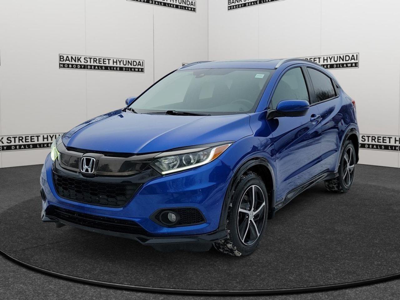The 2019 Honda HR-V Sport, presented in an eye-catching Blue, combined with its AWD system, offers confident handling in diverse driving conditions. This SUV is tailored for those who seek reliability and versatility in a compact package. The exterior of this HR-V Sport boasts stylish alloy wheels and a sunroof/moonroof, accentuating its dynamic appearance. Inside, the vehicle is designed with comfort in mind, featuring heated front seats and a leather-wrapped steering wheel, offering the perfect blend of functionality and style. Equipped with modern technology, this Honda HR-V features Bluetooth connectivity, smart device integration, and a backup camera for ease of use. Safety doesnt take a backseat with lane assist and brake assist ensuring peace of mind on your journeys. For extended road trips, the adaptive cruise control is an invaluable companion, providing both convenience and added safety. This SUV is ideal for active individuals and small families who value practicality without compromising on modern features. Dont miss the opportunity to get behind the wheel of this quality vehicle. Reach out to our dealership today for more information and to schedule a test drive.