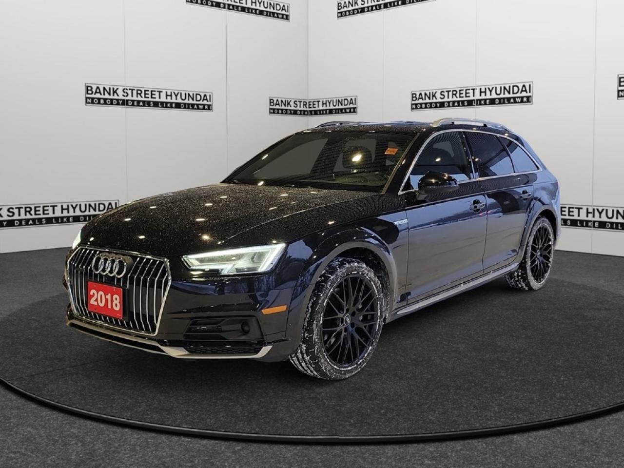 Step into the refined world of the 2018 Audi A4 allroad Technik, a black AWD wagon that sets a remarkable precedent for handling and comfort. Elegantly designed for exceptional balance and control on any terrain, this luxurious vehicle offers a captivating experience on every drive. With a sleek black exterior complemented by sophisticated alloy wheels, the Audi A4 allroad makes a statement on the road. Inside, the blend of leather seats, a leather steering wheel, and leatherette door trim insert elevates its chic and modern aesthetic. Relish the sunny sky through the sunroof/moonroof, and slide effortlessly into heated seats with keyless entry at your convenience. This Audi is as advanced as it is stylish. Stay connected with the integrated navigation system, Bluetooth connectivity, and smart device integration. Safety and technological prowess go hand in hand with features such as a backup camera, lane assist, and parking sensors. Your drives are not only relaxing with the use of cruise control but also safe, thanks to brake assist and the AWD drivetrain ensuring stability in variable conditions. Perfect for professionals or families who appreciate sophistication, performance, and state-of-the-art technology, this Audi A4 allroad is a prime choice. Call us today to find out how this vehicle can become part of your lifestyle!