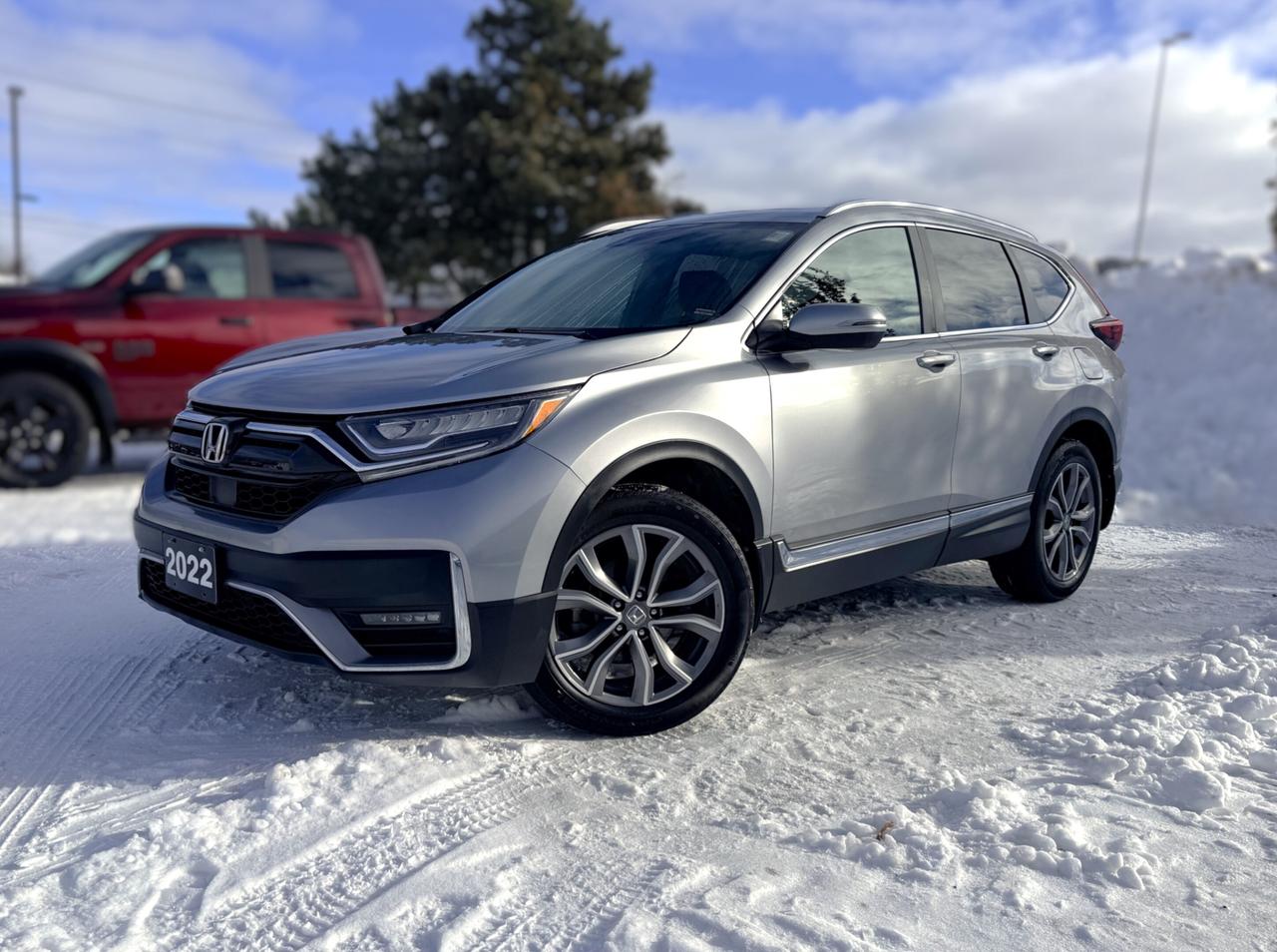 NAVIGATION, PANORAMIC SUNROOF, BACKUP CAMERA, BLUETOOTH, HEATED SEATS, BLIND SPOT, REMOTE START, AND MORE !!!

Turn heads with bold sophistication in our One Owner, Accident-Free 2022 Honda CR-V Touring AWD that adds a little extra luxury to even your most exciting adventures in Lunar Silver Metallic! Motivated by a TurboCharged 1.5 Litre 4 Cylinder generating 190hp for a CVT thats responsive and ready for action. This All Wheel Drive SUV also returns approximately 7.4L/100km on the highway with a rugged yet refined look youll love. Our CR-V shows off LED lighting, fog lamps, a panoramic sunroof, a hands-free liftgate, alloy wheels, roof rails, dual chrome exhaust outlets, and heated power mirrors with built-in turn signals.

Get behind the wheel of our Touring cabin thats as comfortable as it is versatile. Highlights include heated leather front and rear seats, a power-adjustable first row, a heated leather steering wheel, dual-zone automatic climate control, proximity key entry, pushbutton ignition, and remote start. Find your way with fantastic ease using our full-colour navigation system that goes with a 7-inch touchscreen, Apple CarPlay&reg;, Android Auto&reg;, Bluetooth&reg;, WiFi tethering, wireless charging, and an upgraded sound system.

Honda adds premium peace of mind with advanced safety measures such as a multi-angle rearview camera, a blind-spot monitor, and intelligent Sensing technologies such as adaptive cruise control, automatic braking, and lane-keeping assistance. So get into our CR-V Touring and get more out of your life! Save this Page and Call for Availability. We Know You Will Enjoy Your Test Drive Towards Ownership! 

Bustard Chrysler prides ourselves on our expansive used car inventory. We have over 100 pre-owned units in stock of all makes and models, with the largest selection of pre-owned Chrysler, Dodge, Jeep, and RAM products in the tri-cities. Our used inventory is hand-selected and we only sell the best vehicles, for a fair price. We use a market-based pricing system so that you can be confident youre getting the best deal. With over 25 years of financing experience, our team is committed to getting you approved - whether you have good credit, bad credit, or no credit! We strive to be 100% transparent, and we stand behind the products we sell. For your peace of mind, we offer a 3 day/250 km exchange as well as a 30-day limited warranty on all certified used vehicles.