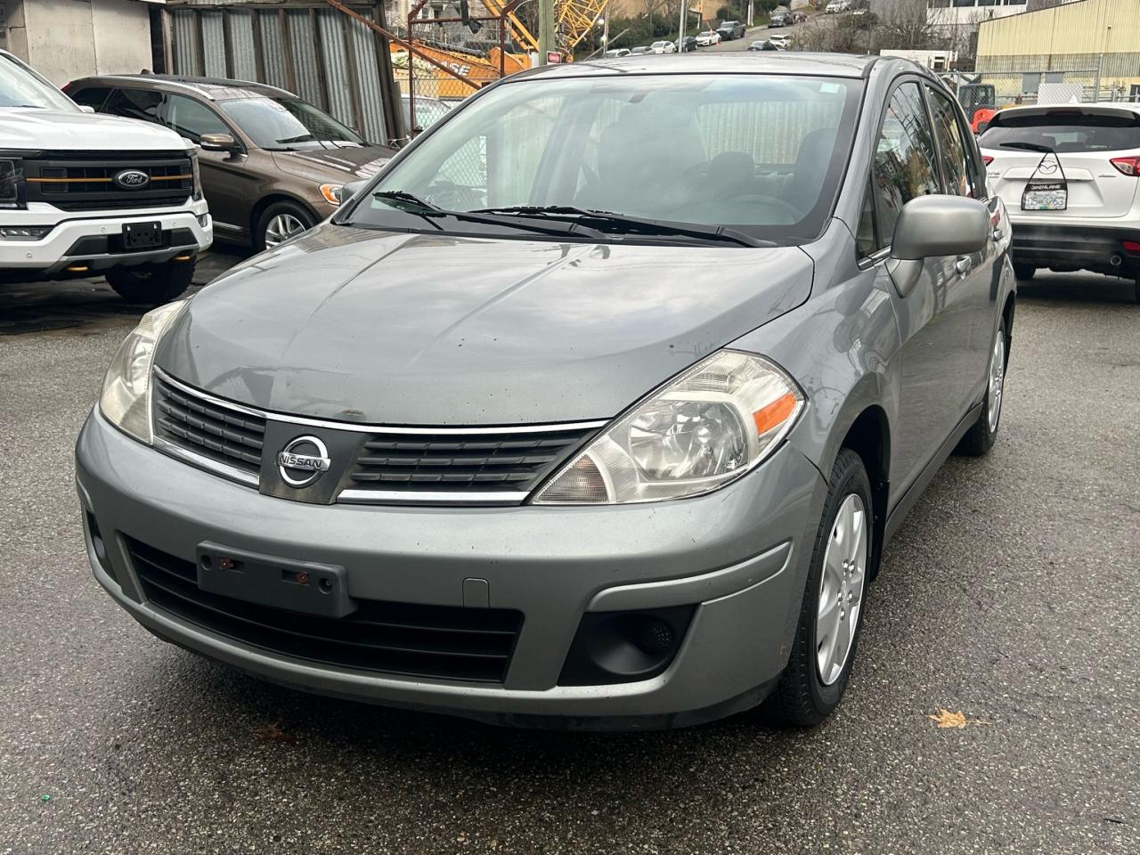 <p>Please check out our website&nbsp;<strong><a href=https://milani.biz/>https://milani.biz/</a>&nbsp;</strong>for&nbsp;<strong>Carfax&nbsp;</strong>information. Looking for a reliable and economical sedan? Check out this 2007 Nissan Versa 1.8 S, now available at Milani Auto Sales! This practical four-door sedan is perfect for navigating city streets or cruising on the highway. With its automatic transmission and front-wheel drive, the Versa offers a smooth and comfortable driving experience. While this vehicle has 238,000 km, its a testament to the Versas reputation for dependability.</p><p>The 2007 Versa 1.8 S is equipped to make your daily drives easy and enjoyable. Its fuel-efficient gasoline engine will help keep your costs down, and the sedan body style provides ample space for passengers and cargo. Plus, with its well-designed interior, youll be riding in comfort. Visit Milani Auto Sales to see this fantastic vehicle and take it for a test drive!</p><p>Here are five features that make this Versa a standout:</p><ul><li><strong>Fuel Sipping Efficiency:</strong> Save money at the pump with this economical gasoline engine!</li><li><strong>Smooth Automatic Transmission:</strong> Enjoy effortless driving in any traffic situation.</li><li><strong>Spacious Interior:</strong> Plenty of room for passengers and everyday cargo.</li><li><strong>Reliable Performance:</strong> A proven track record for dependability.</li><li><strong>Easy to Handle:</strong> The perfect car for driving in the city.</li></ul><p><strong><em>Powered by AutoIntelligence&trade;</em></strong> Vehicle information has been generated using artificial intelligence and is provided for informational purposes only. While efforts are made to ensure accuracy, please confirm all details directly with the dealer.</p>