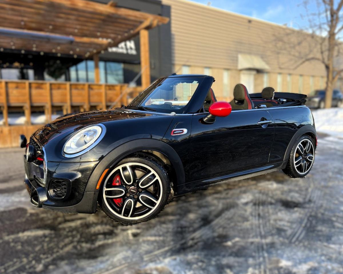 <p><span style=font-family:Cambria,serif;font-size:10.5pt;>2017 MINI Cooper Convertible John Cooper Works  Check out this Accident Free MINI JCW Convertible that has only 74,769 kms & comes fully equipped with THOUSANDS IN UPGRADES including the amazing JCW Bluetooth Sport Exhaust, MINI Sport Foglamps, Technology Package with Voice Control & Mini Connected XL, Rear Park Distance Control Camera (PDC), Smartphone Integration, Bluetooth Hands Free Phone, Cruise Control with Braking Function, Crank up those tunes with the optional Harman Kardon Sound System w/Wireless Music Streaming & Satellite Radio Pre-Wire, Never take the keys out of your pocket with the very convenient Keyless Comfort Access with Push Button Start, Led Interior Mini Excitement Package, This energetic Mini is eager to please with an 228Hp 4cly 2.0L-Bi-Turbo mated to an Automatic Transmission w/Paddle Shifters, Green Eco engine Auto Start-Stop MINI Driving Modes for increased fuel economy, MINI offers a Sunroof option with their convertible like no other brands which allows you to open just the sunroof on those cloudy days or fully retract the soft top with only 15 seconds open to close power top, Light Package with LED Adaptive Headlights, Essentials Package, Rain Sensing Wipers, A/C w/Automatic Dual Zone Climate Control, MINI Yours Sports JCW Multi-Function Leather Wrapped Sport Steering Wheel w/Tilt & Telescopic, 18 MINI LA JCW Cup Spoke 2-tone Alloy Wheels, Finished in Midnight Black Metallic w/Upgraded JCW Carbon Black Dinamica Sportsize Heated Seats, you will love the added safety and worry free driving with the FWD including Performance Control & Dynamic Damping Control will bring you, Experience Minis legendary performance & fuel economy BUY WITH CONFIDENCE as every vehicle has guaranteed title with available extended warranty and includes a copy of the extensive Mechanical Fitness Assessment (MFA) & CarFax history report with no reported accidents</span> <a target=_blank rel=noopener noreferrer href=https://vhr.carfax.ca/?id=L%2Fw6nEqDqZ+ROEZk2aAgztaLn4WEoBoo>https://vhr.carfax.ca/?id=L%2Fw6nEqDqZ+ROEZk2aAgztaLn4WEoBoo</a><span style=font-family:Cambria,serif;font-size:10.5pt;>priced at $26,995.00, Competitive financing rates available with $0 down, for additional inventory listings & verifiable customer reviews visit or like us on our Facebook business page at</span><a target=_blank rel=noopener noreferrer href=https://nam12.safelinks.protection.outlook.com/?url=https%3A%2F%2Fwww.facebook.com%2FBCWLUXURY%2F&data=05%7C01%7C%7C49037207e269409d393408da2abbf030%7C84df9e7fe9f640afb435aaaaaaaaaaaa%7C1%7C0%7C637869283919776206%7CUnknown%7CTWFpbGZsb3d8eyJWIjoiMC4wLjAwMDAiLCJQIjoiV2luMzIiLCJBTiI6Ik1haWwiLCJXVCI6Mn0%3D%7C3000%7C%7C%7C&sdata=KT5A32yHJFN2iw5utjLCQnk2B12DF0kAGQ4FVcFdstY%3D&reserved=0><span style=color:blue;><span style=font-family:Cambria,serif;font-size:10.5pt;text-decoration:none;text-underline:none;>https://www.facebook.com/BCWLUXURY/</span></span></a><span style=font-family:Cambria,serif;font-size:10.5pt;> and </span><a target=_blank rel=noopener noreferrer href=https://na01.safelinks.protection.outlook.com/?url=https%3A%2F%2Fbcwautomotivegroup.ca%2F%3Ffbclid%3DIwAR387Lb1rwVh_JOSPNqDyBxMntmO0XIjsSe7G6mkcS-nxBBxGrWPzUEGvik&data=04%7C01%7C%7C494dd18690344bf6f7e508d9785a98d6%7C84df9e7fe9f640afb435aaaaaaaaaaaa%7C1%7C0%7C637673152772014668%7CUnknown%7CTWFpbGZsb3d8eyJWIjoiMC4wLjAwMDAiLCJQIjoiV2luMzIiLCJBTiI6Ik1haWwiLCJXVCI6Mn0%3D%7C1000&sdata=HJx1B3W2XCrSc%2FpJw3y2BzSW9IVH4kDlJxkMZV196So%3D&reserved=0><span style=color:blue;><span style=background:white;border:none windowtext 1.0pt;font-family:Cambria,serif;font-size:11.5pt;padding:0cm;>https://bcwautomotivegroup.ca/</span></span></a><span style=font-family:Cambria,serif;font-size:10.5pt;>BCW Automotive Group is your Mini Cooper Specialist! Now is the time to join the charismatic club of Mini Owners. Ph 403-606-9008 to make an appointment most anytime for your personalized viewing (including holidays/evenings & weekends) to serve you best by appointment only!We Know You Will Enjoy Your Test Drive Towards Ownership! AMVIC Licensed Dealer Stock #JCWCV17M.<o:p></o:p></span></p>