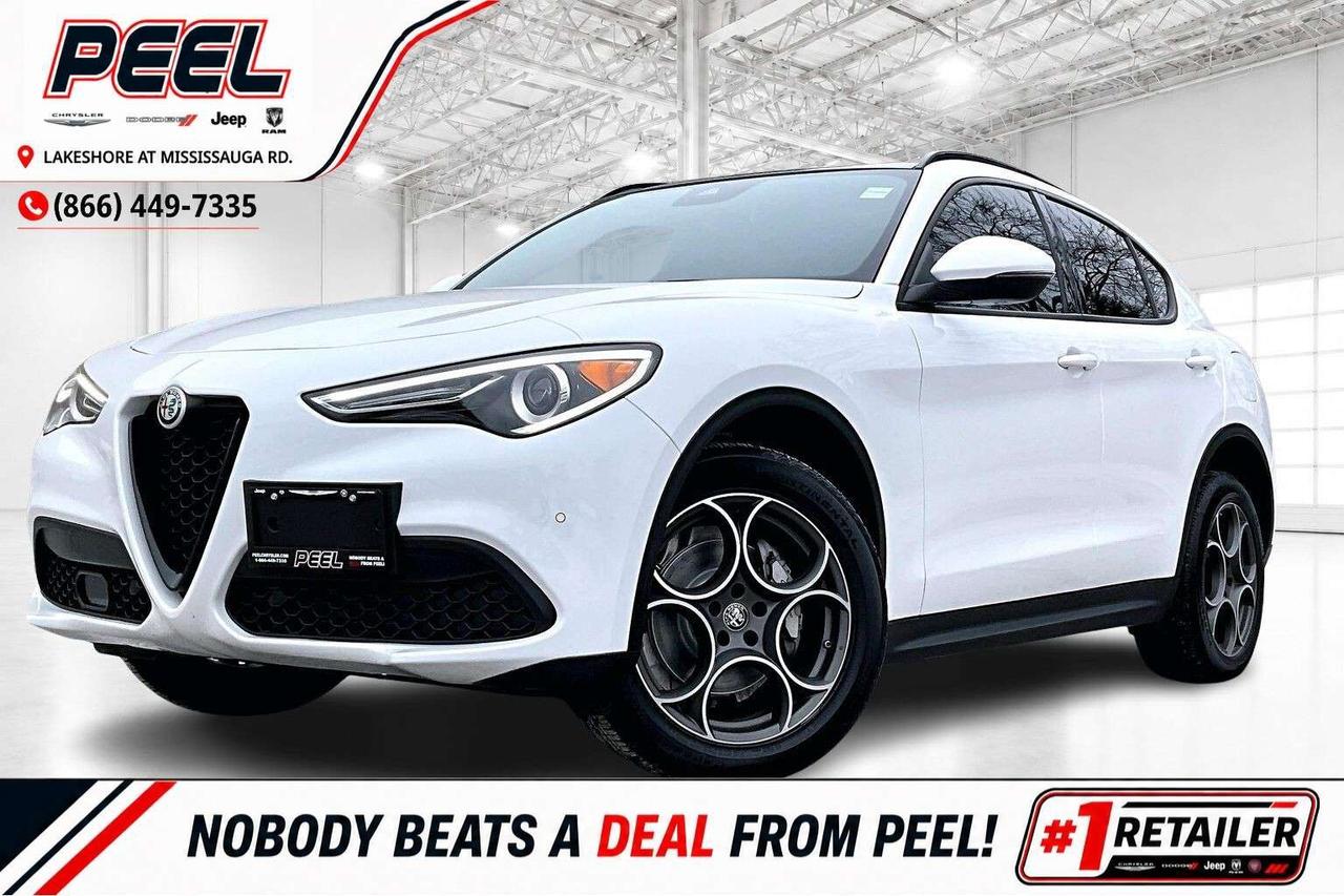COME SEE WHY NOBODY BEATS A DEAL FROM PEEL! Your Source for ALL make and models used cars and trucks. 2022 Alfa Romeo Stelvio Sprint AWD | 2.0L Turbocharged I-4 Engine | Alfa White | Leather-faced Bucket Seats | Dual-pane Panoramic Sunroof | Adaptive Cruise Control | Lane Keep Assist | Forward Collision Warning | Blind Spot Monitoring | Wireless Smartphone Charging Pad | Apple CarPlay & Android Auto | Heated Steering Wheel | Remote Start | 19" Sport 5-hole Wheels One Owner Italian style meets everyday ease inside this 2022 Alfa Romeo Stelvio Sprint, where leather faced bucket seats, a heated steering wheel, and a dual pane panoramic sunroof create a quiet, airy cabin that turns commutes into something you look forward to. Technology keeps every drive smooth and confident, with adaptive cruise control, lane keep assist, forward collision warning, blind spot monitoring, wireless Apple CarPlay and Android Auto, a wireless charging pad to keep cords out of sight, and remote start for warm winter departures. Outside, Alfa White paint highlights the coupe like profile and signature 19 inch sport five hole wheels, while the responsive 2.0L turbo and surefooted AWD deliver poised traction in any season. With a One Owner Carfax history, this Stelvio Sprint offers genuine Italian sophistication and real world versatility at a compelling value. ______________________________________________________ FREE CarFax included! Click the CarFax link in the listing to view the report. Our advertised prices are for consumers/end users only and are not intended for dealer, wholesale, exporter, or broker purchases. ______________________________________________________ Peel Chrysler is based in Port Credit, Mississauga, and proudly serves customers across Ontario and Canada, including Toronto, Oakville, North York, Richmond Hill, Ajax, Hamilton, Niagara Falls, Brampton, Scarborough, Vaughan, London, Windsor, Cambridge, Kitchener, Waterloo, Brantford, Sarnia, Pickering, Huntsville, Milton, Woodbridge, Aurora, Newmarket, Orangeville, Georgetown, Markham, North Bay, Sudbury, Barrie, Oshawa, Kingston, Innisfil, and surrounding areas. Browse our selection of used cars, trucks, SUVs, vans, Ram, Jeep, Dodge, Chrysler, FIAT, and all makes and models at peelchrysler.com. ______________________________________________________ Disclaimer: Prices are for consumer/end-user purchases only. Advertised prices are all-in and include all dealer fees and charges, including the $499 loan processing fee where applicable, except HST, Fuel and Licensing, unless otherwise stated. Payments, rates, and terms are subject to approved credit and may change without notice. If a trade-in has an outstanding loan balance and Peel Chrysler is required to facilitate the lien payout, a $349 lien payout fee applies. Most pre-owned vehicles originally come with two keys; however, all Peel Chrysler pre-owned vehicles come standard with one key unless otherwise stated. Vehicle images may be digitally adjusted or enhanced for presentation purposes and may not always reflect the exact appearance of the vehicle. While we make every effort to ensure accuracy, vehicle details, features, options, materials, history, specifications, pricing, availability, and CarFax information should be verified with Peel Chrysler before purchase.