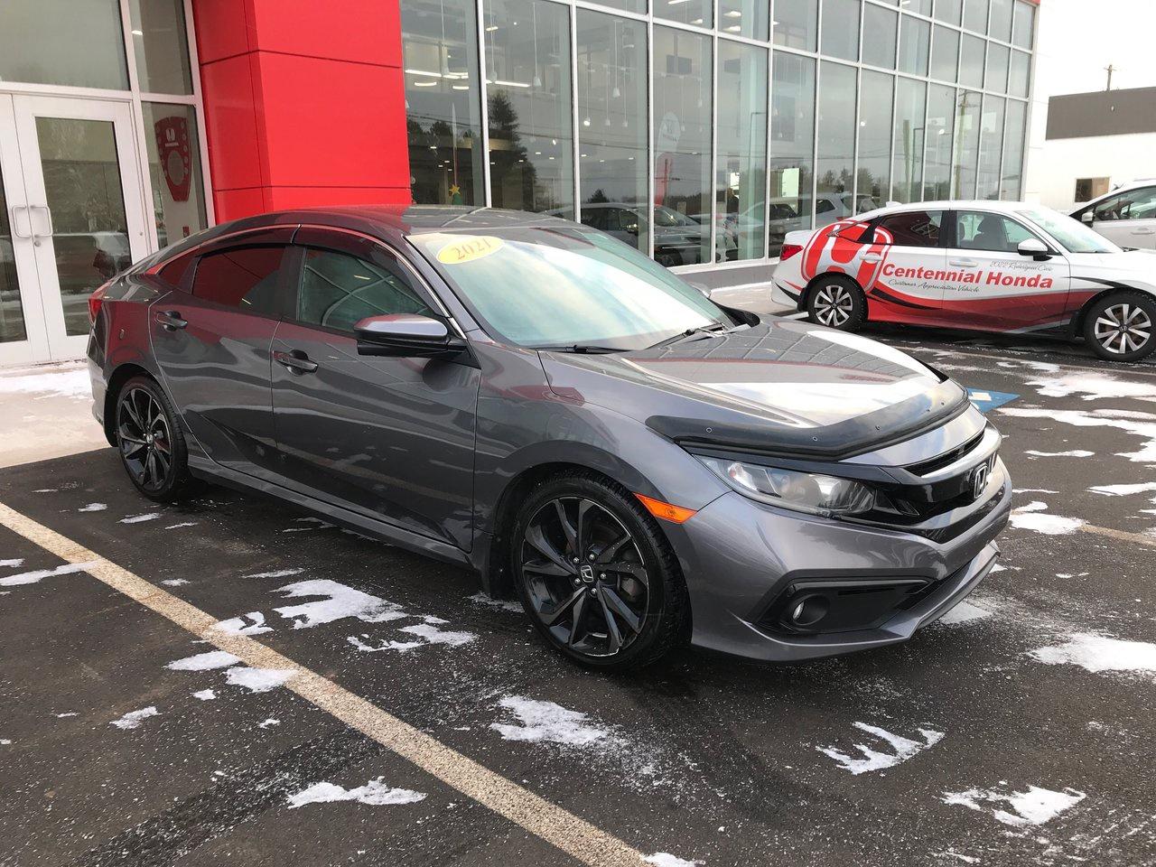 <span>In the 2021 Honda Civic Sport, the standard equipment list is an extremely long one. Theres a sunroof, remote start, an 8-way power drivers seat, dual-zone automatic climate control, LaneWatch blind spot display, and prioximity access/pushbutton start. Theres also a multi-angle rearview camera, heated front seats, 8-speaker audio, auto high beams, and a 7-inch touchscreen with Apple CarPlay/Android Auto.<span class=Apple-converted-space>&nbsp;</span></span>




<span>Dont forget Honda Sensing tech, including lane keeping assist, adaptive cruise control, and forward collision warning. And at the heart of every Honda is a world-class engine. In this case, its a 158-horsepower four-cylinder rated at 6.1 L/100km on the highway.</span>




<span>Canadas favourite car &ndash; over the last quarter-century &ndash; is better than ever. The 2021 Honda Civic Sport is a high-end version of Canadas most popular car with a long list of exterior upgrades, as well: 18-inch wheels, centre exhaust, spoiler, and fog lights, plus paddle shifters, aluminum pedals, and special Black combi seats.</span>




<span style=font-weight: 400;>Thank you for your interest in this vehicle. Its located at Centennial Honda, 515 Central Street, Summerside, PEI. We look forward to hearing from you; call us toll-free at 1-902-436-9158.</span>