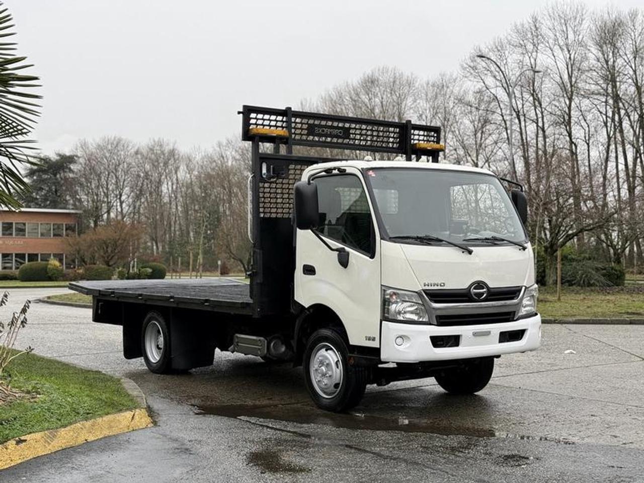 This 2015 Hino 195 flat deck truck is powered by a reliable 5.1L 4-cylinder diesel engine paired with an automatic transmission and rear-wheel drive, making it well suited for commercial hauling, deliveries, and fleet use. The truck features a 2-door cab with air conditioning and heat, an AM/FM radio with CD player, power door locks, power windows, power mirrors, and heated mirrors, along with an engine brake for added control under load. Finished in white with a grey cloth interior, it is equipped with a flat deck measuring approximately 16 feet 8 inches long and 8 feet 7 inches wide, while the overall vehicle measures about 23 feet 2 inches long, 8 feet 7 inches wide, and 9 feet 9 inches high. This Hino 195 carries a GVWR of 8,850 kg (19,500 lb), offering a strong balance of capacity, durability, and maneuverability for commercial operations. This item is currently OFFSITE. You must register an appointment with our office to schedule an offsite viewing. Appointments must be made a minimum of one business day in advance (and as defined by the days that Repo.com is open for business) before your appointment can be scheduled and confirmed. We may, at our own discretion, instead opt to transport smaller items to Repo.coms main yard for viewing purposes.  $27,830.00 plus $375 processing fee, $28,205.00 total payment obligation before taxes.  Listing report, warranty, contract commitment cancellation fee, financing available on approved credit (some limitations and exceptions may apply). All above specifications and information is considered to be accurate but is not guaranteed and no opinion or advice is given as to whether this item should be purchased. We do not allow test drives due to theft, fraud, acts of vandalism and undetectable impaired driving. Instead we provide the following benefits: Complimentary Warranty (with options to extend), Limited Money Back Satisfaction Guarantee on Fully Completed Contracts, Contract Commitment Cancellation, and an Open-Ended Sell-Back Option. Ask seller for details or call 604-522-REPO(7376) to confirm listing availability.