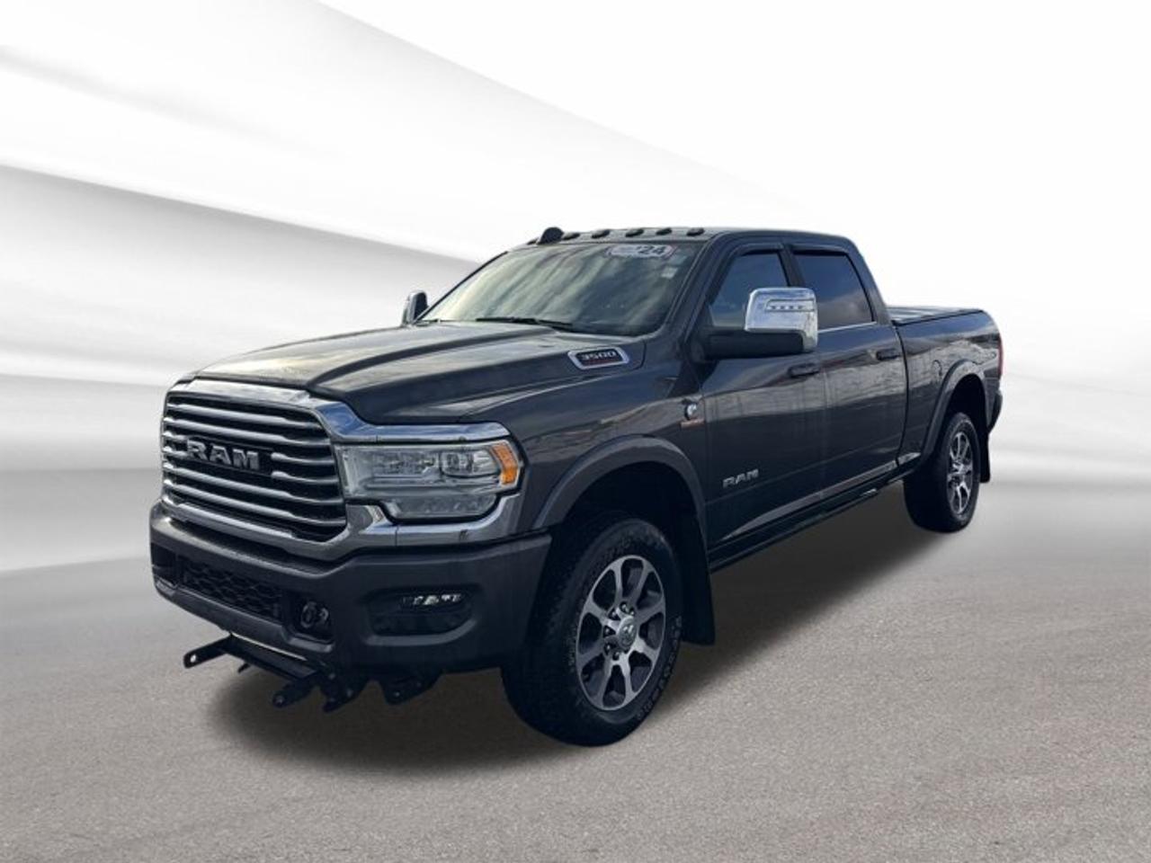 Experience the unmatched capability and refined luxury of the 2024 RAM 3500 Limited Longhorn, now available at Steele Halifax Chrysler Dodge Jeep Ram FIAT in Halifax. This used truck, finished in a sophisticated grey exterior with a tan interior, combines rugged performance with upscale features. With just 28,001 km on the odometer, it delivers both reliability and comfort for demanding tasks or daily drives.TRUCK FEATURES4-wheel drive for superior traction and controlIntercooled Turbo Diesel I-6 6.7 L engineAutomatic transmission for smooth gear shiftsHeavy-duty build ideal for towing and haulingFEATURES OF THE 3500 Limited LonghornPower sunroof for open-air driving enjoymentWireless charging for convenient device powerForward Collision Warning for added safetyPremium interior design with tan accentsADVANCED SAFETY FEATURESForward Collision Warning systemRobust frame for enhanced crash protectionAdvanced braking technology for confident stopsMultiple airbags for comprehensive occupant safetyPERFORMANCE AND EFFICIENCYIntercooled Turbo Diesel I-6 6.7 L engine4-wheel drive for all-weather capabilityAutomatic transmission for effortless drivingEfficient diesel power for long-distance haulingCOMFORT AND CONVENIENCEPower sunroof for extra ventilation and lightSpacious cabin with four-door accessWireless charging for mobile devicesEasy entry and exit with wide door openingsTECHNOLOGY AND CONNECTIVITYWireless charging pad for compatible devicesForward Collision Warning for proactive safetyIntegrated controls for seamless operationModern infotainment system for entertainmentCARGO SPACELarge truck bed for versatile cargo needsAmple storage throughout the cabinFlexible space for tools and equipmentRear seating area for passengers or gearWHAT OTHER OWNERS LIKEPowerful diesel engine for heavy-duty tasksComfortable and spacious interior layoutAdvanced safety features for peace of mindSmooth and responsive automatic transmissionThis 2024 RAM 3500 Limited Longhorns VIN is: 3C63R3FL9RG149206.