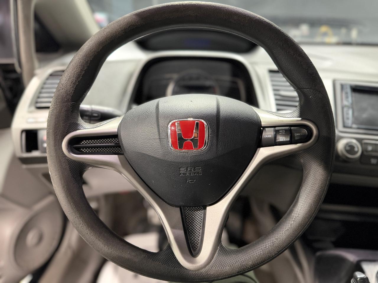 2010 Honda Civic 4dr Man DX-G Photo