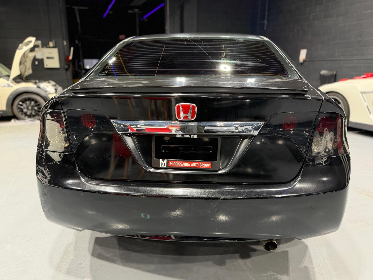 2010 Honda Civic 4dr Man DX-G Photo