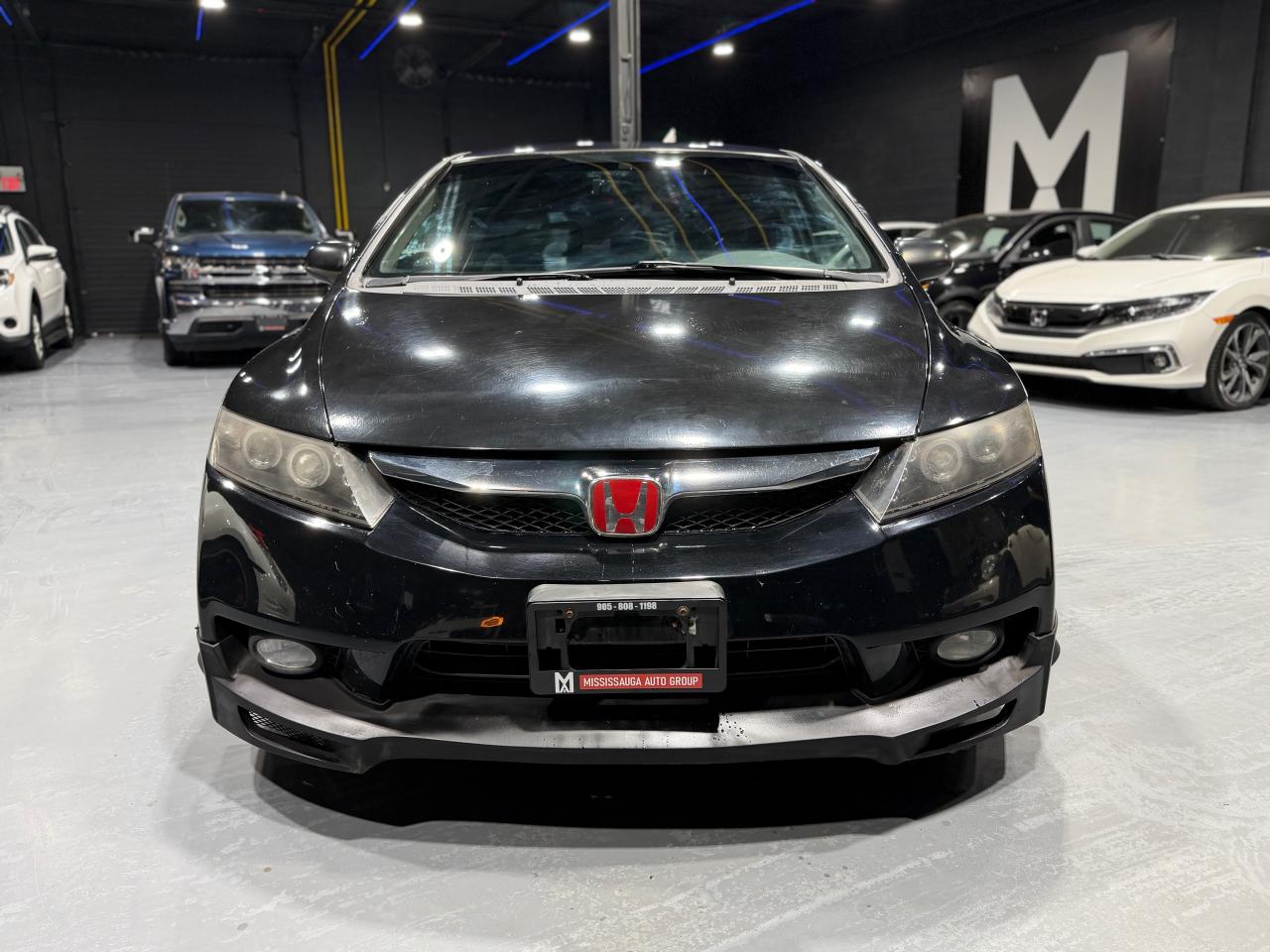 2010 Honda Civic 4dr Man DX-G Photo