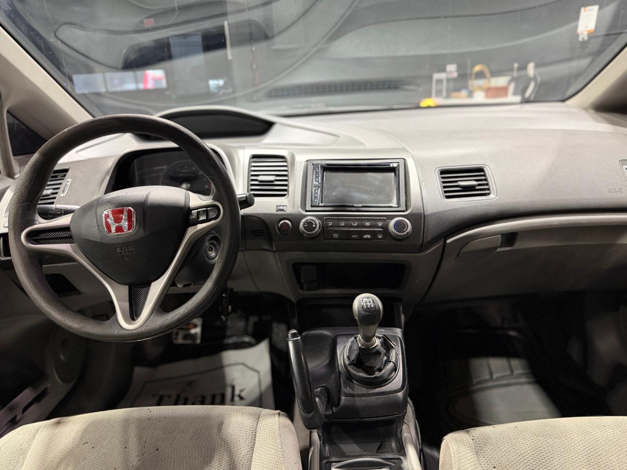 2010 Honda Civic 4dr Man DX-G Photo