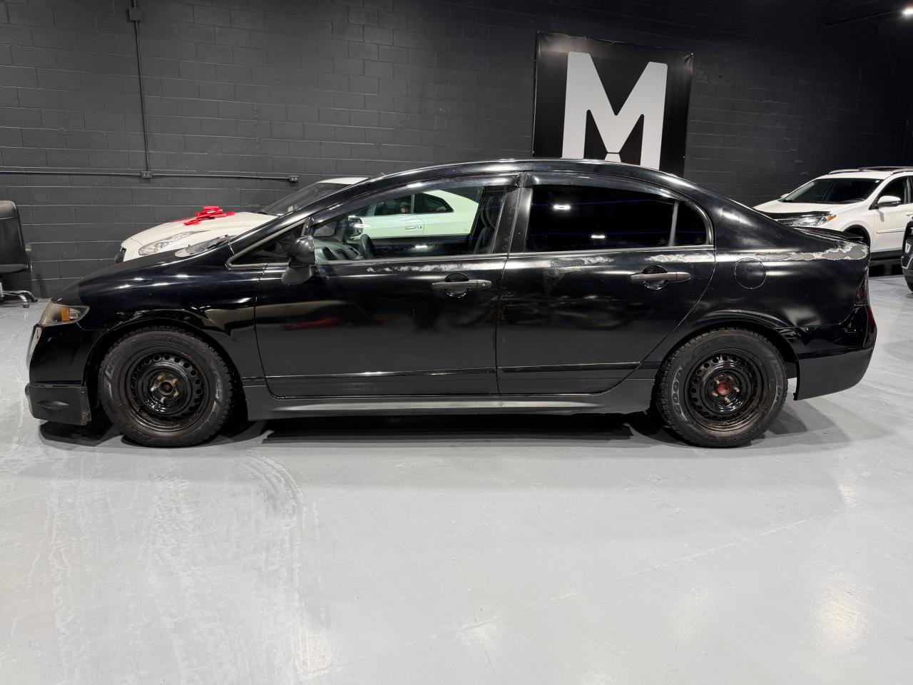 2010 Honda Civic 4dr Man DX-G Photo